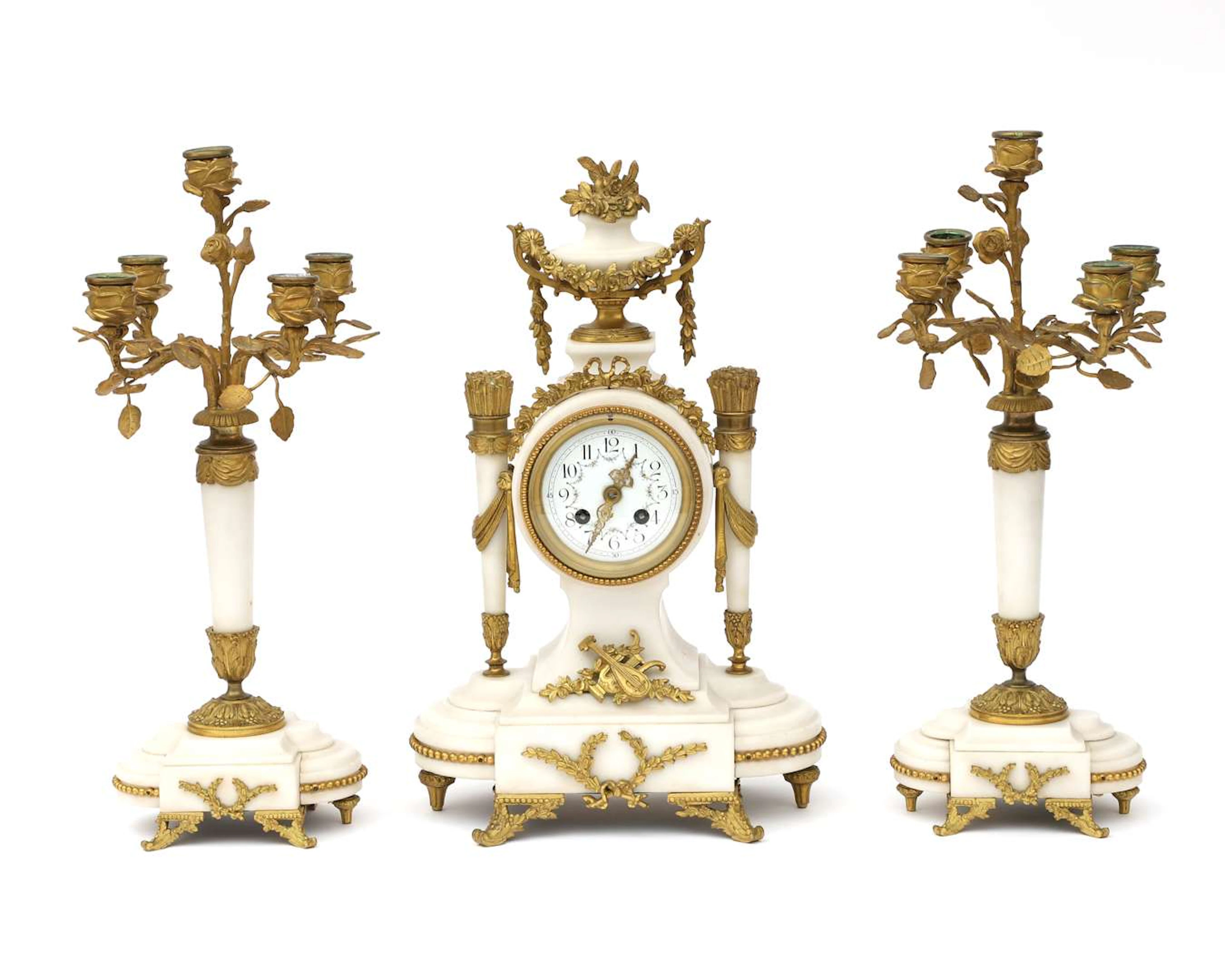 A three-piece alabaster clock set, France, c. 1900