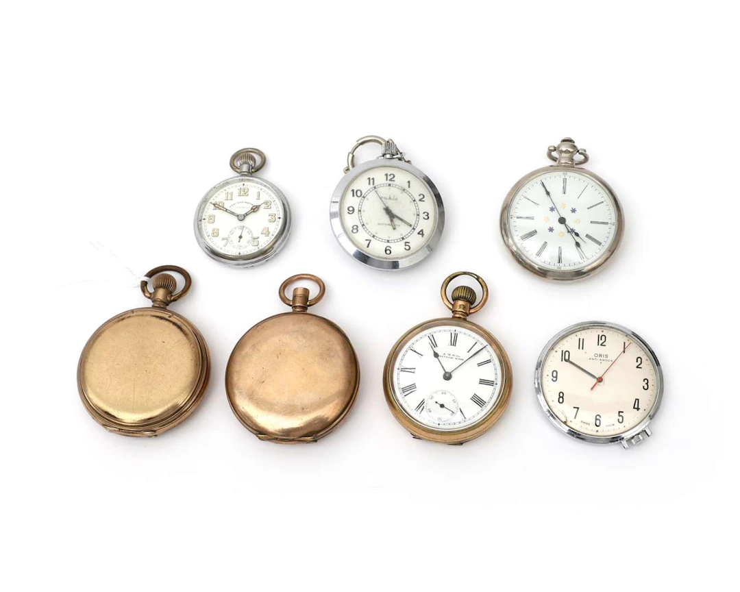 Seven pocket watches, including an Oris Anti-Shock T watch
