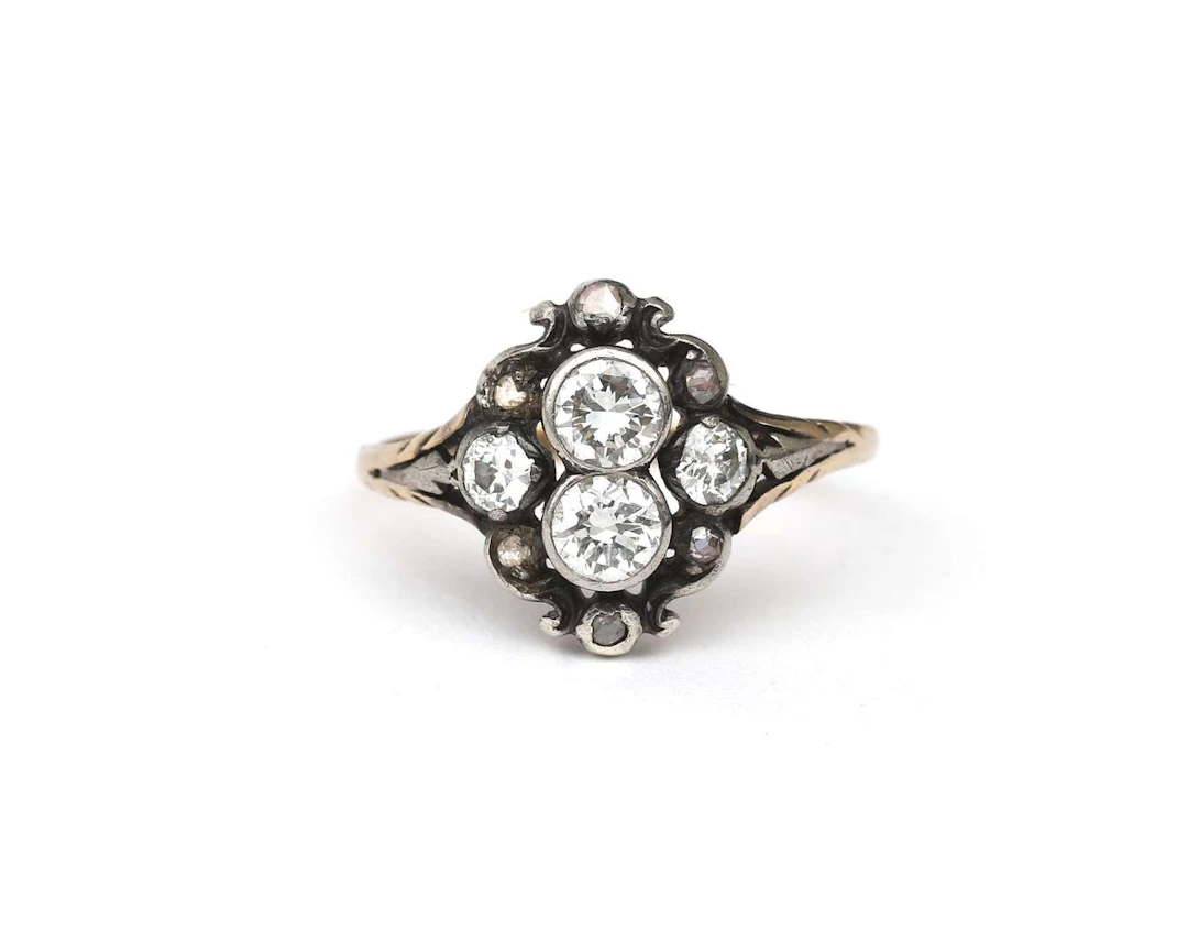 A 14-carat yellow gold and silver ring set with a diamond, late 19th century