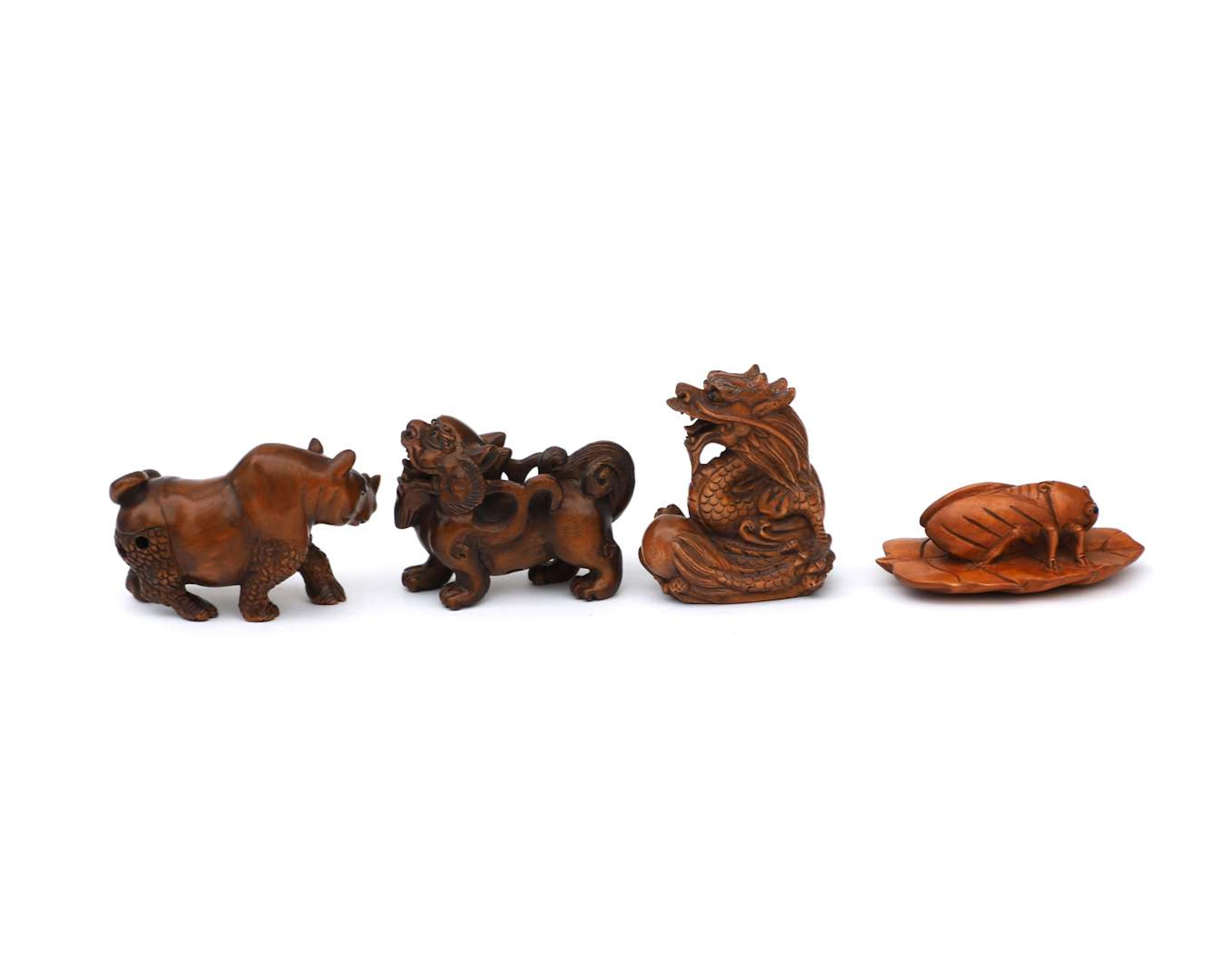 four wooden netsuke