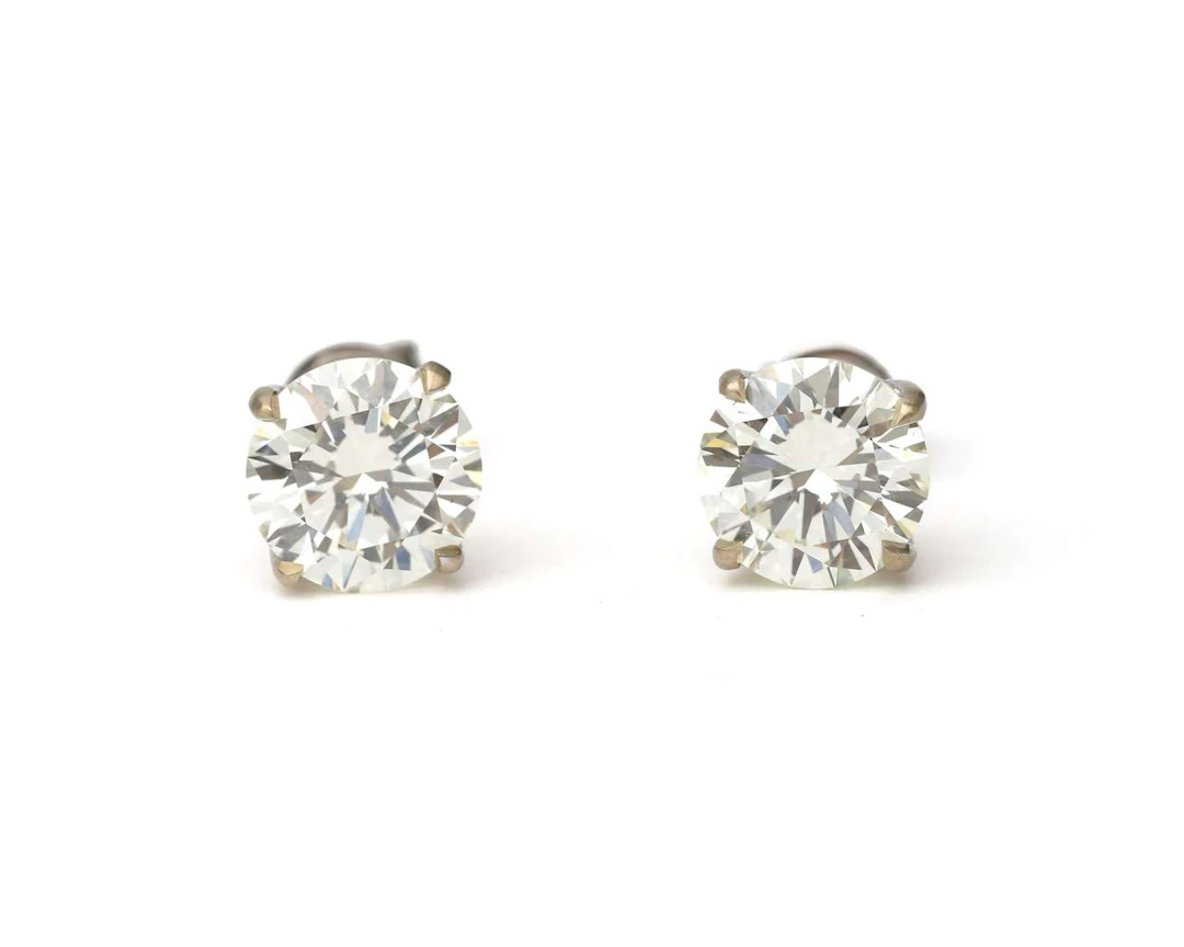 A pair of 18-carat white gold diamond stud earrings, totalling approx. 4.52 ct.