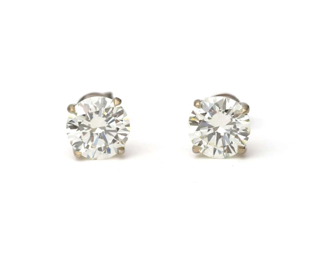 A pair of 18-carat white gold diamond stud earrings, totalling approx. 4.52 ct.