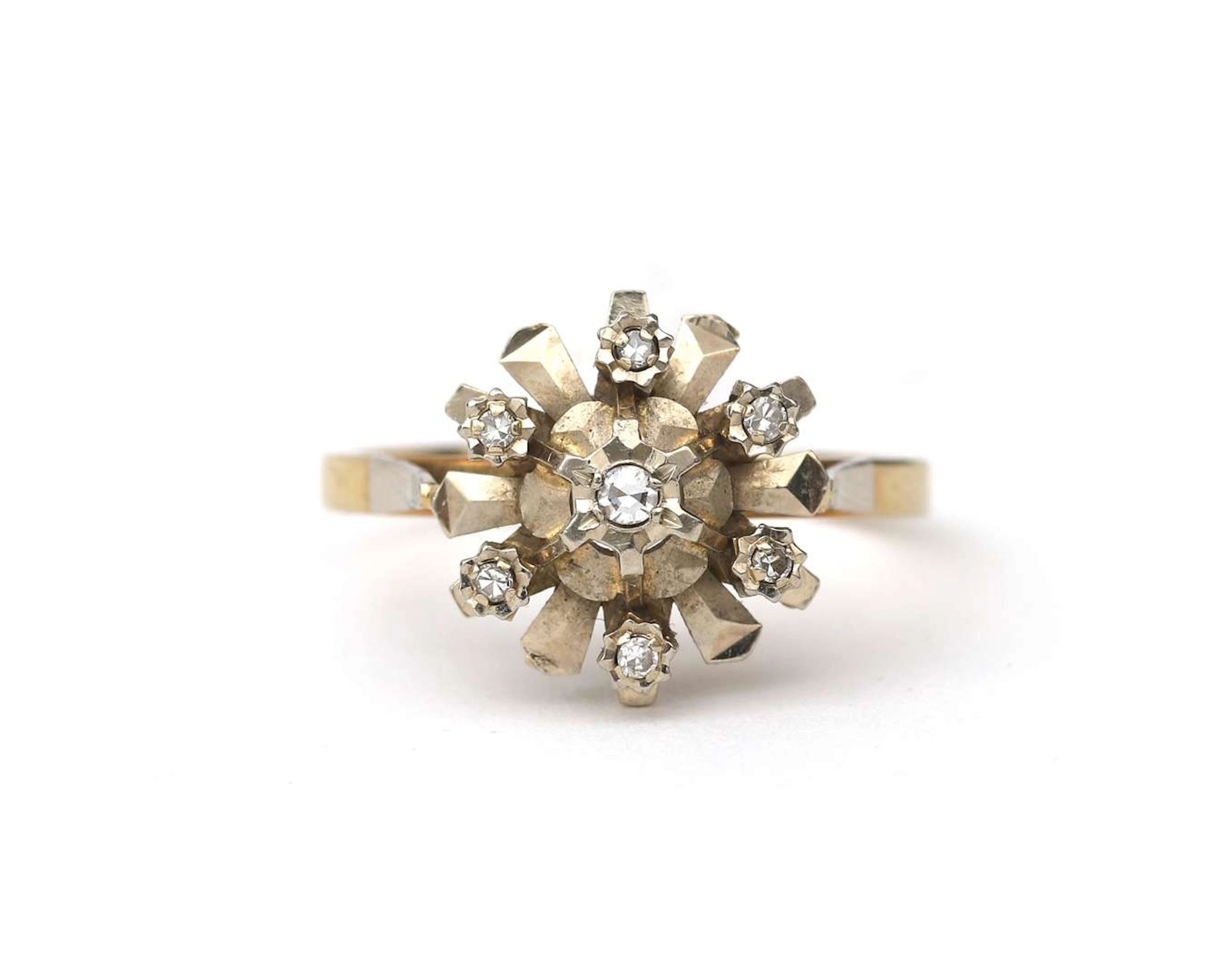 A 14-carat two-tone gold ring with a diamond