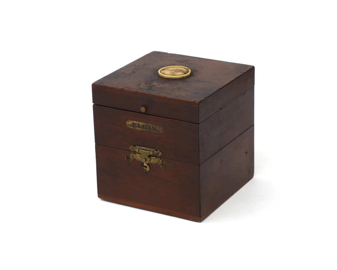 A ‘Father Time’ marine chronometer in a case, manufactured by: Elgin