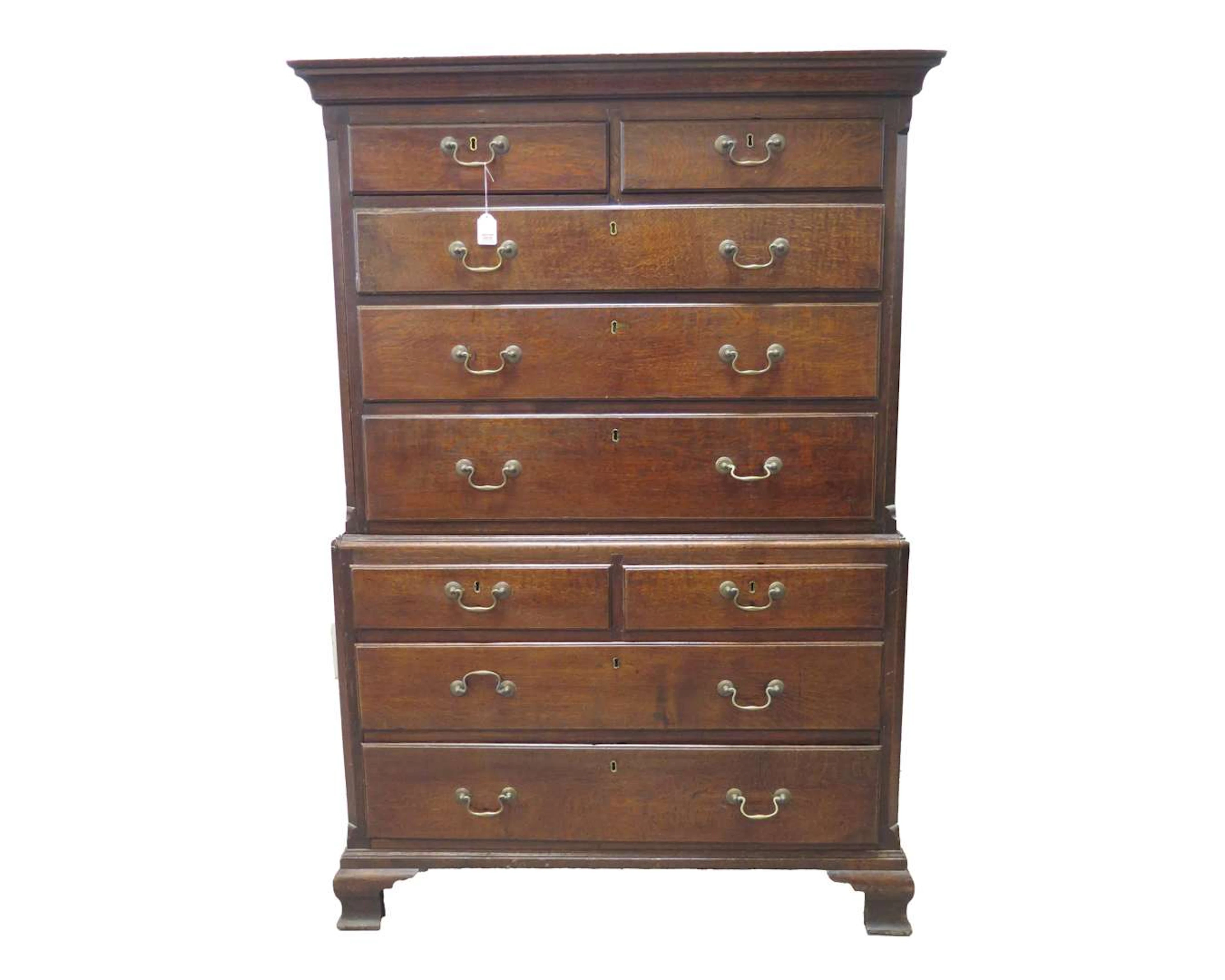 An oak chest of drawers with eight drawers, known as a ‘tallboy’.