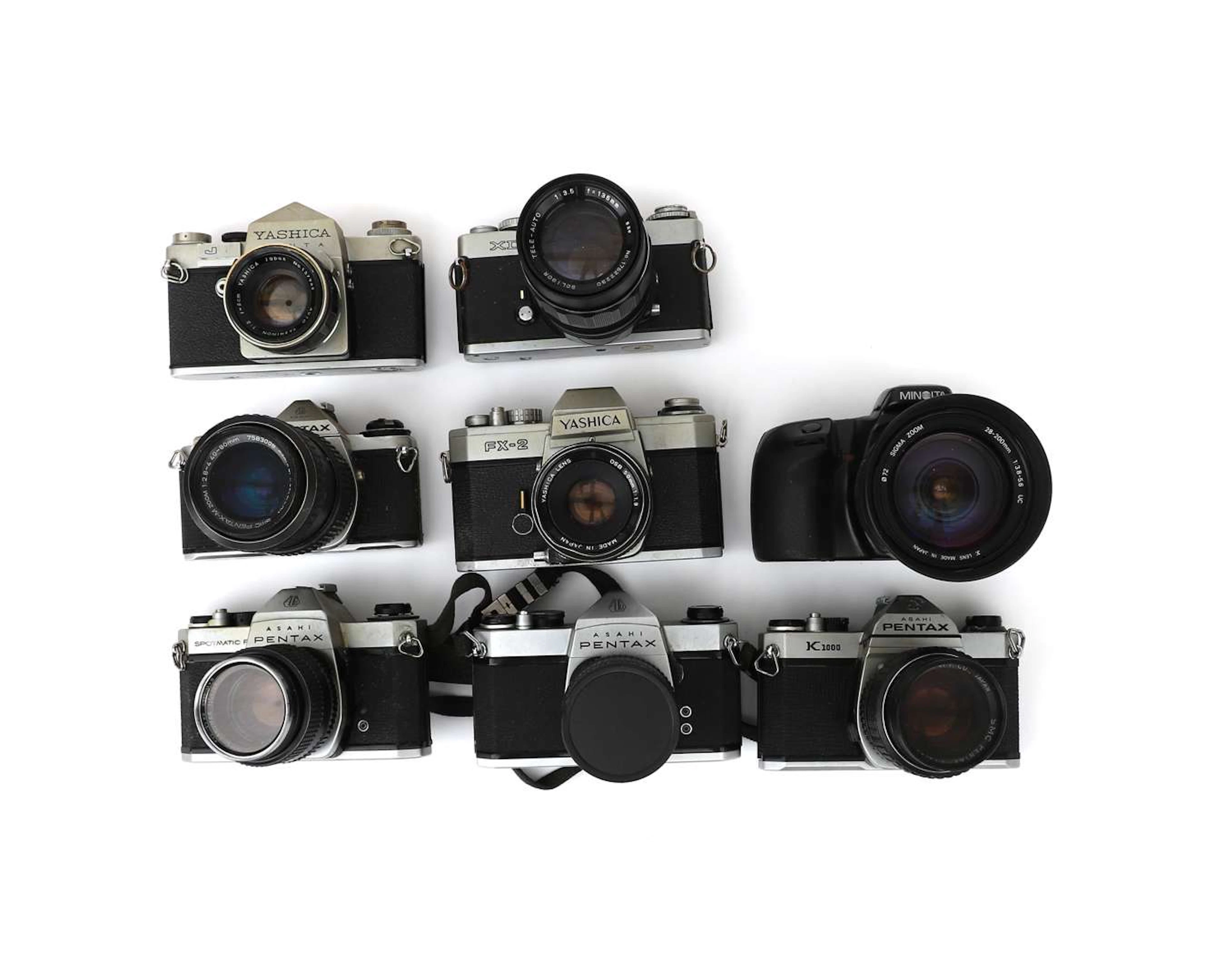 A collection of Japanese 35mm cameras, including Minolta, Yashica