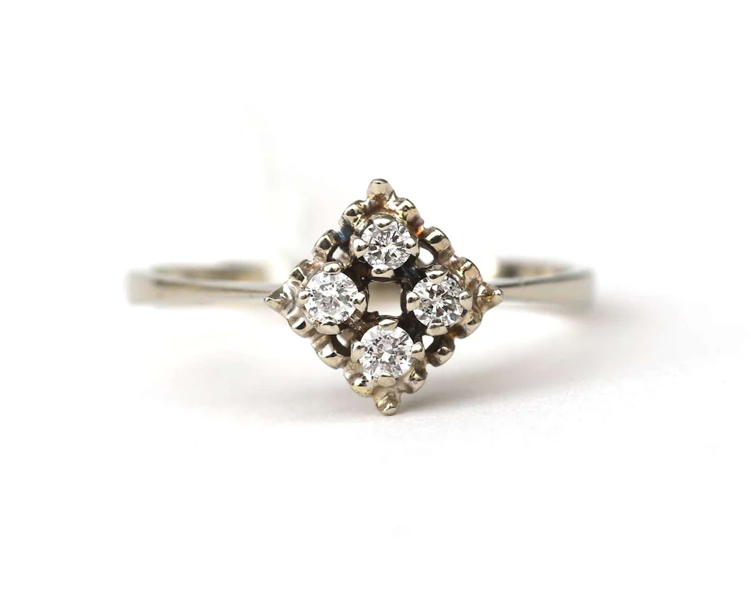 A 14k white gold ring with diamonds