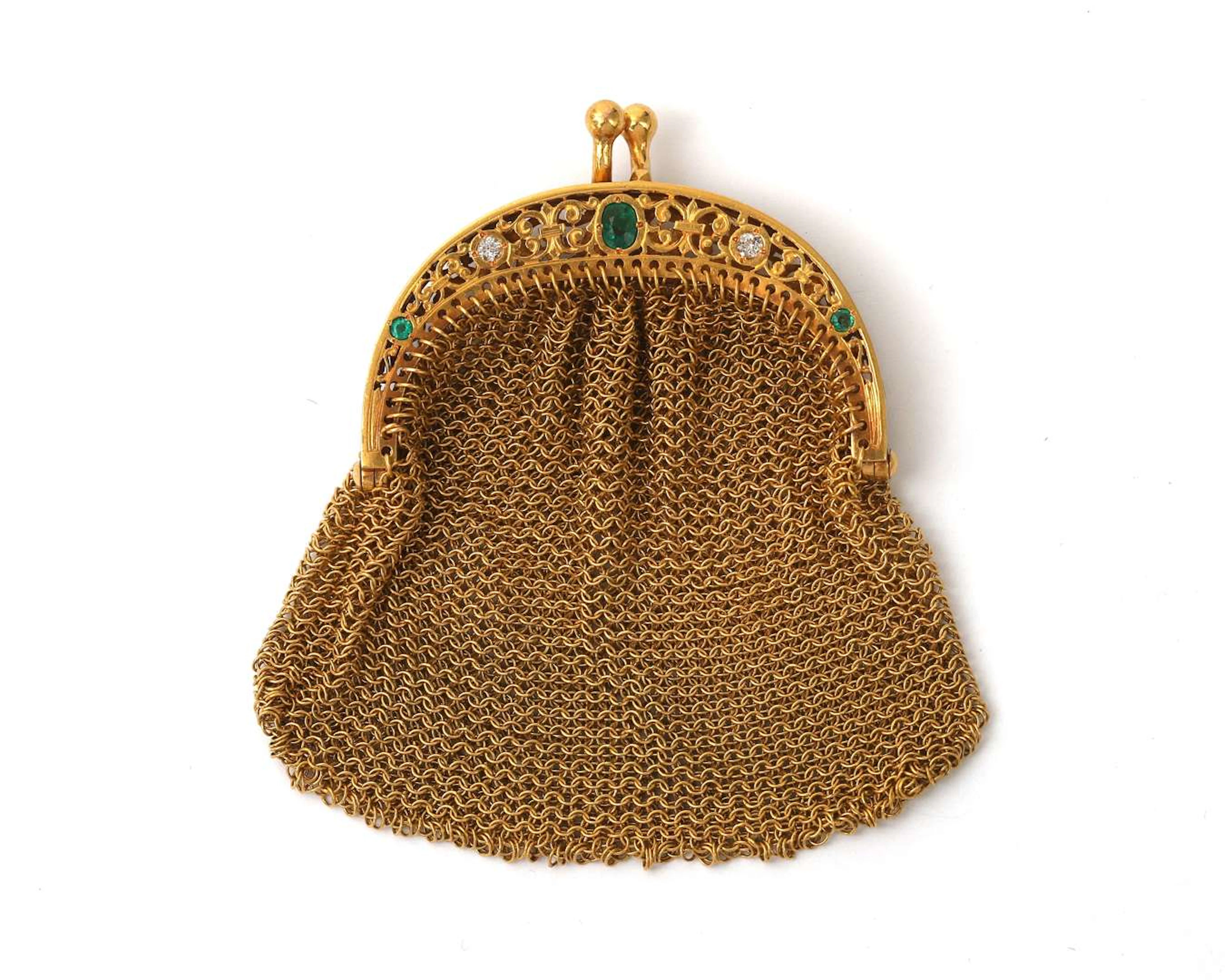 An 18k yellow gold purse with emerald and diamonds
