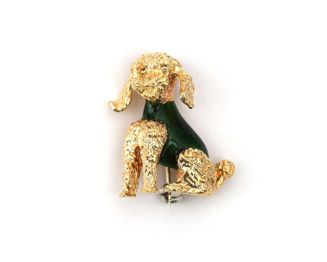 An 18-carat yellow gold enamelled brooch in the shape of a poodle
