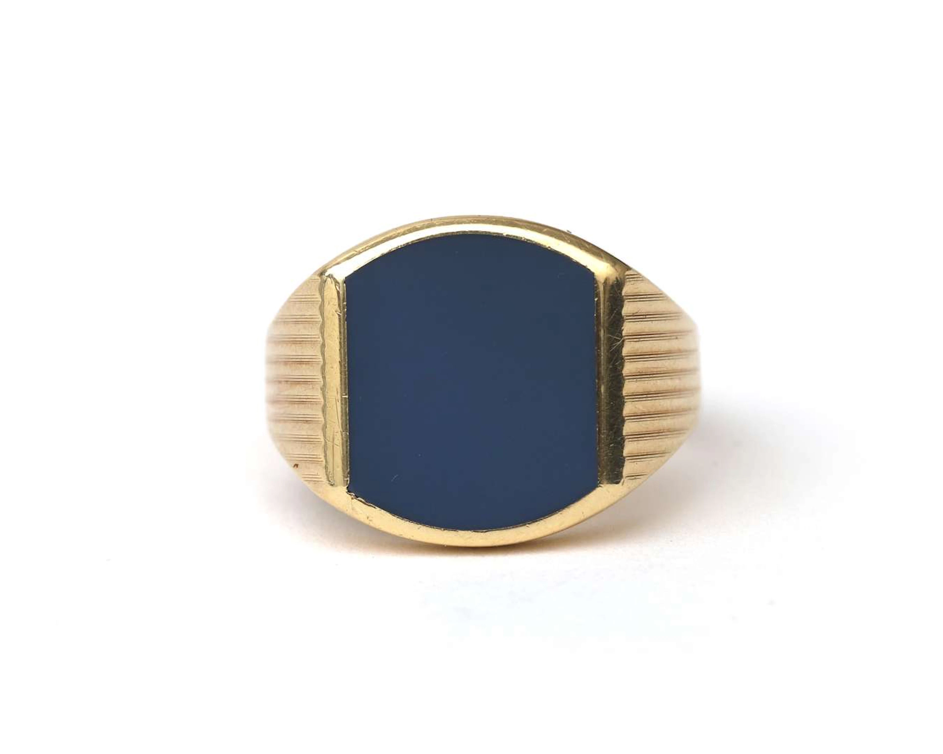 A 14k yellow gold men's ring with light blue layer stone