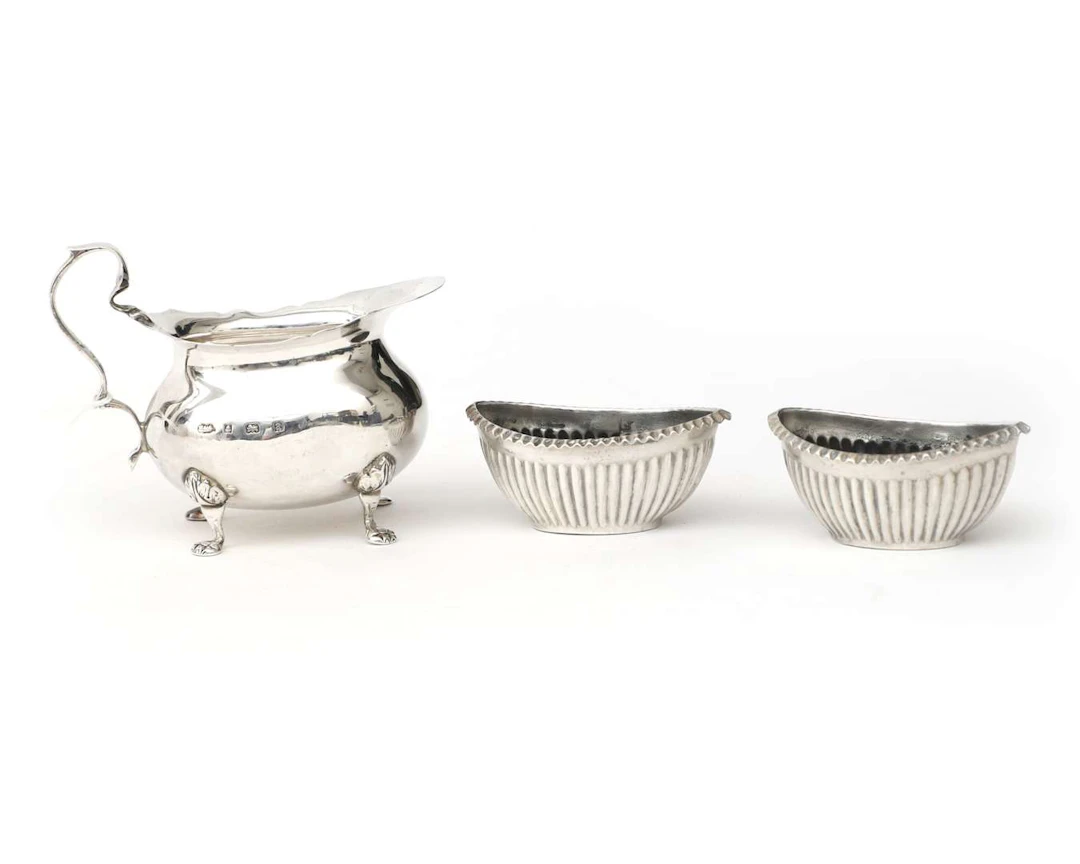 A first-grade silver cream jug and two salt cellars, England, Birmingham, 1900