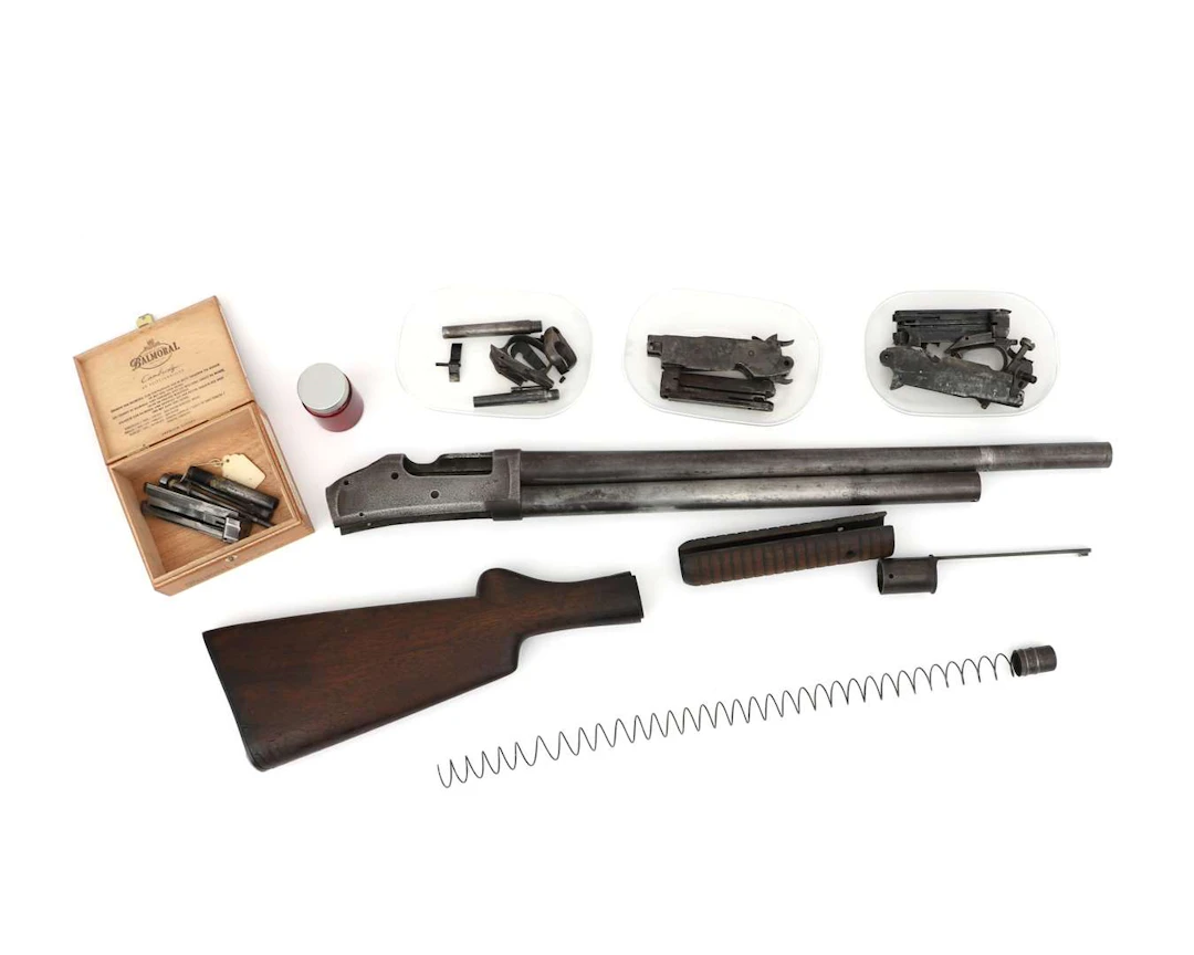 A set of parts for a slide-action rifle, Model 1893, manufactured