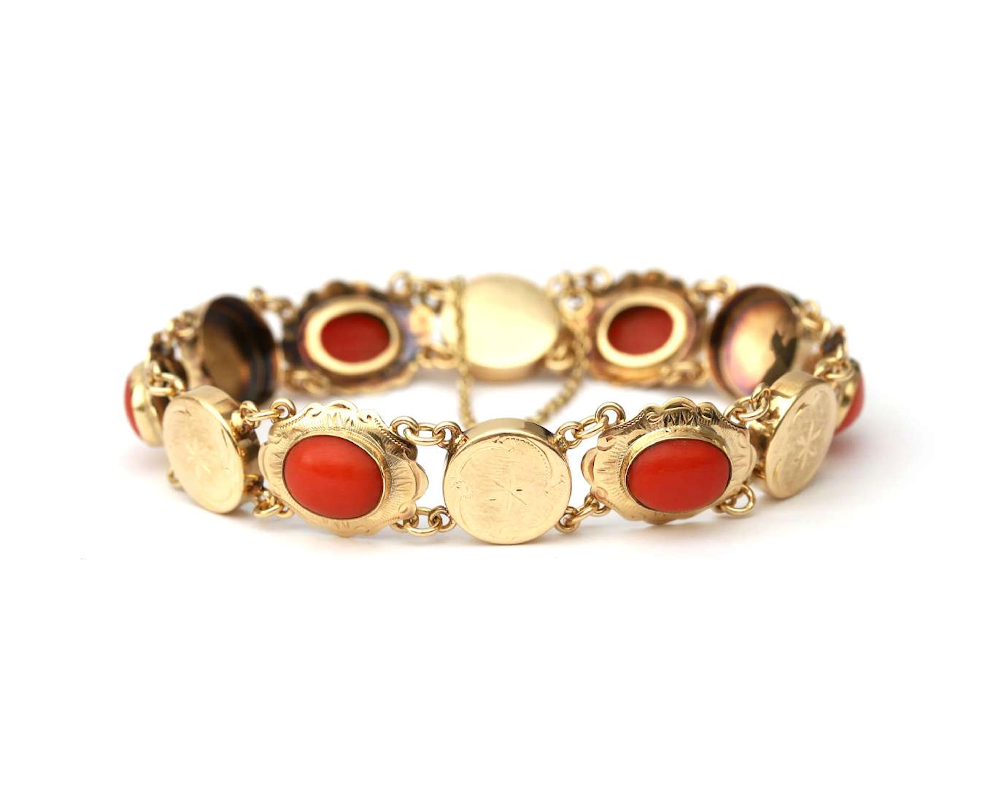A 14k yellow gold bracelet with coral