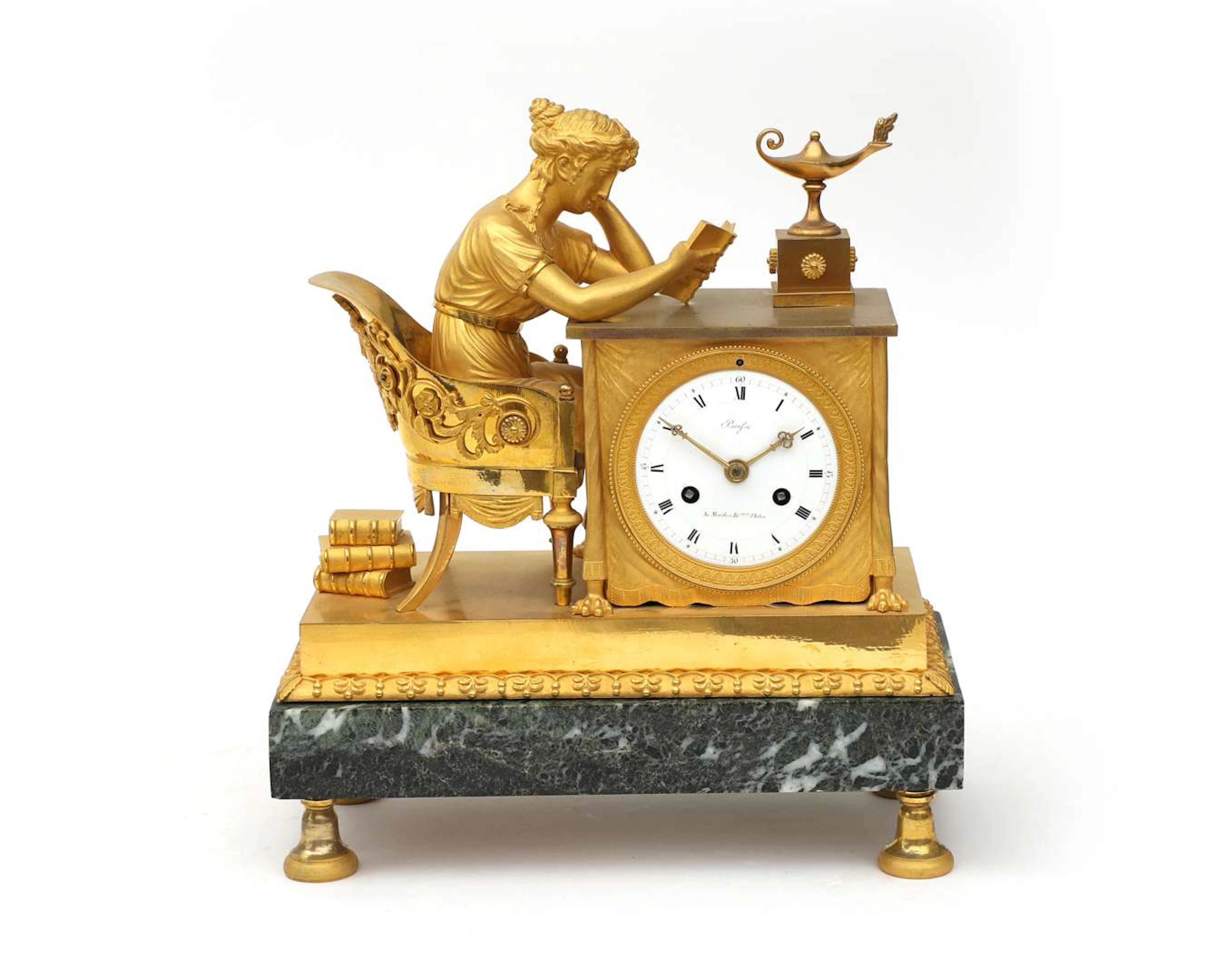 A bronze empire mantel clock 'La liseuse', after design by Jean-Andre