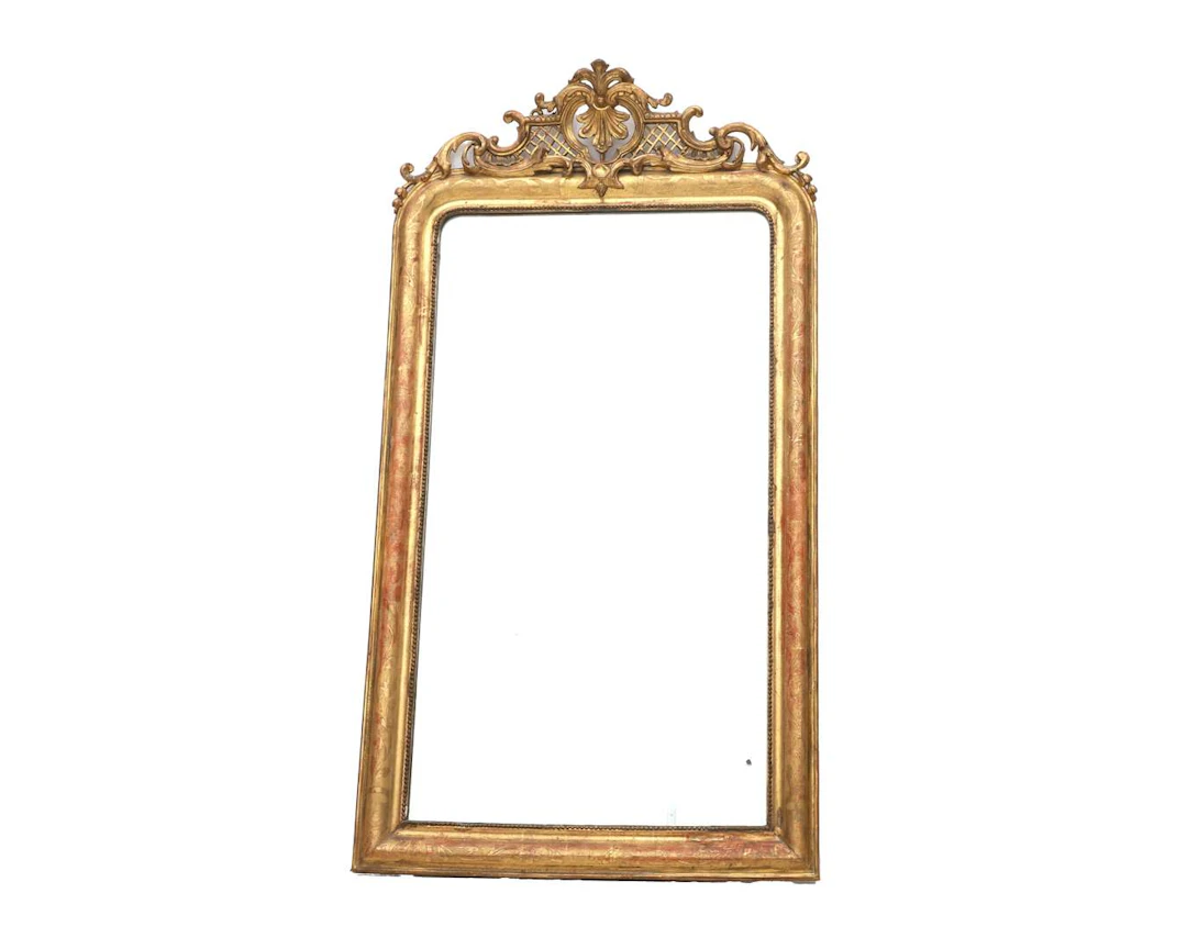 A mirror in a gold-coloured wooden frame, 19th century