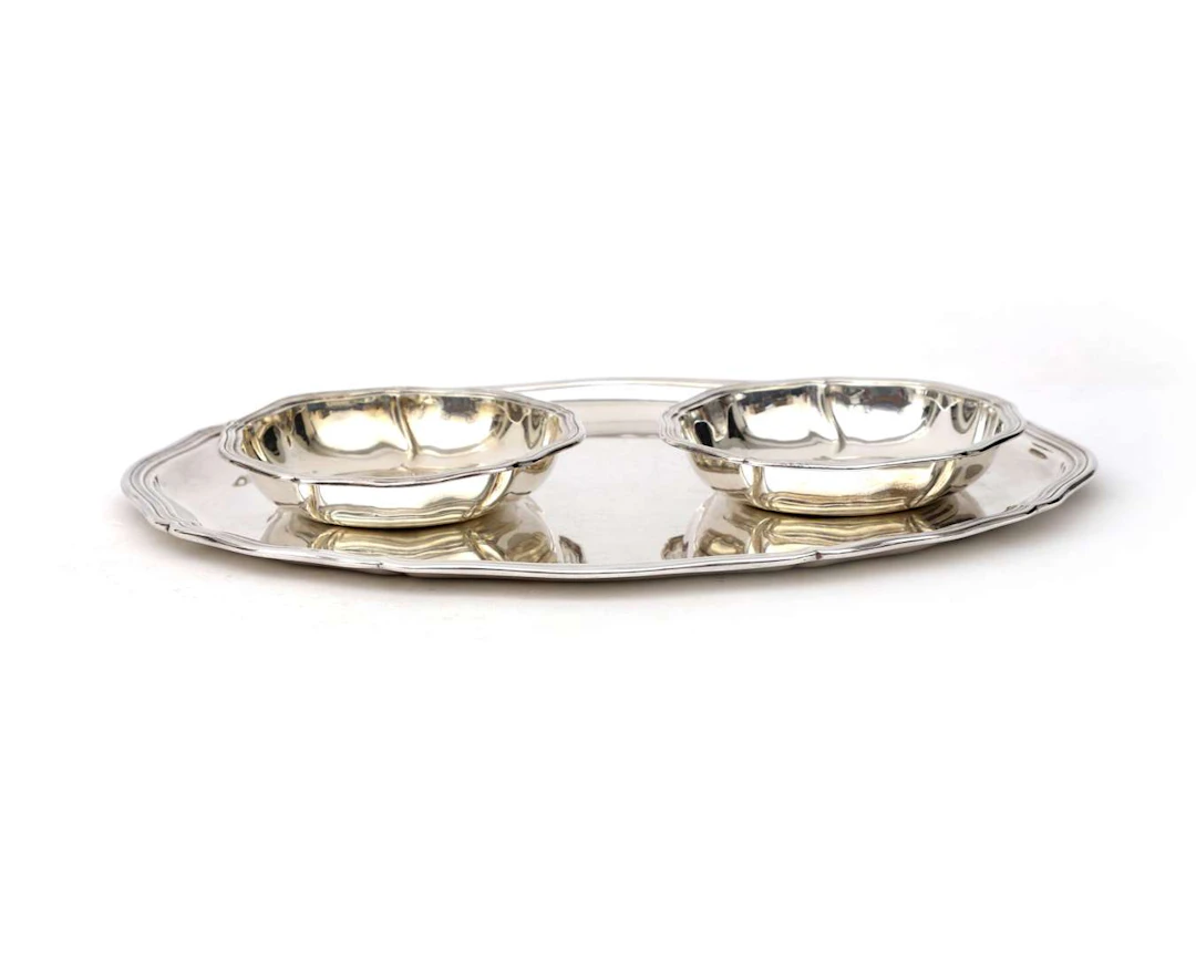 An oval-shaped silver tray with two small bowls, Germany, Schwäbisch