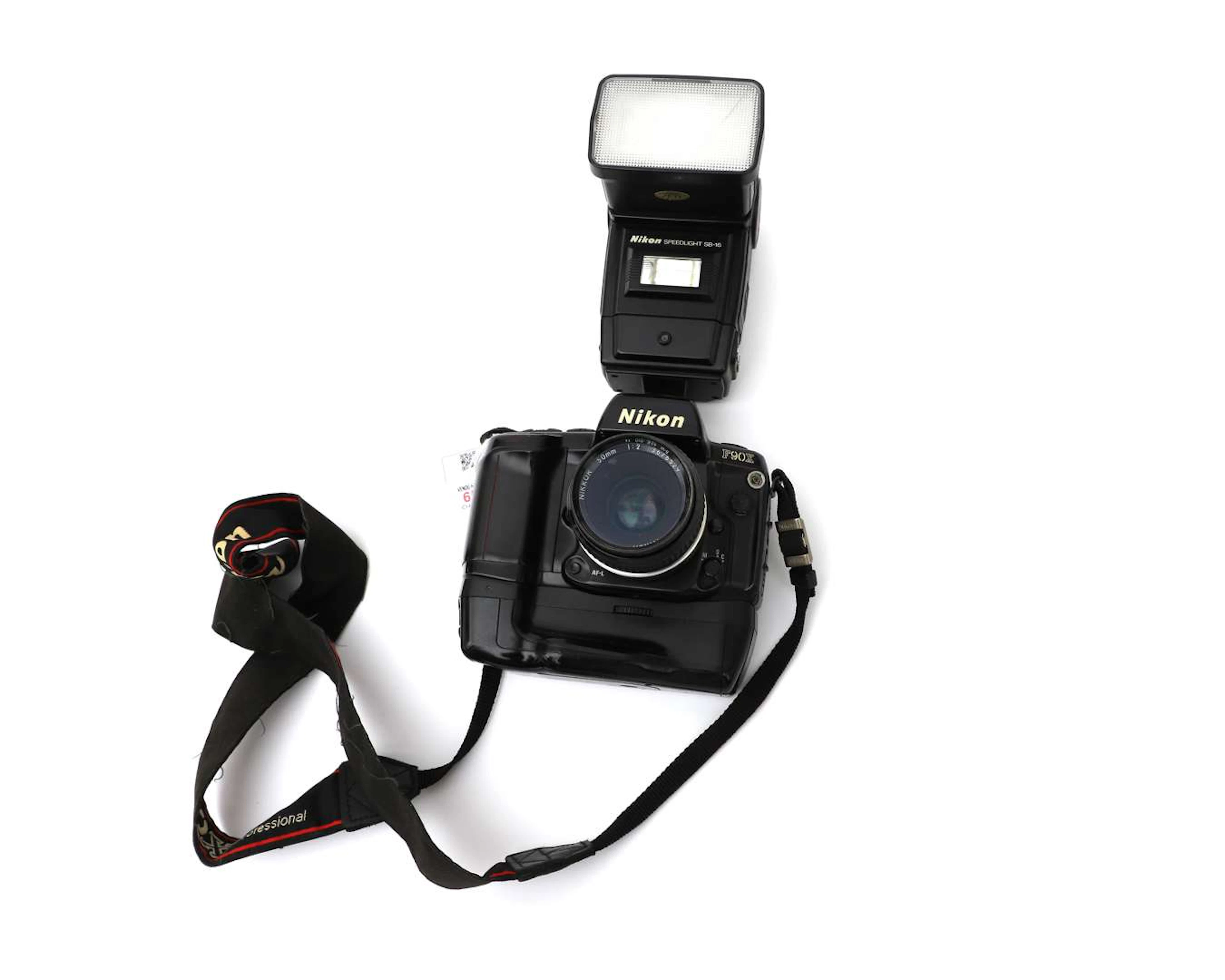 A Nikon F90X camera with a Nikon MB-10 grip and a Nikon SB-16 flash