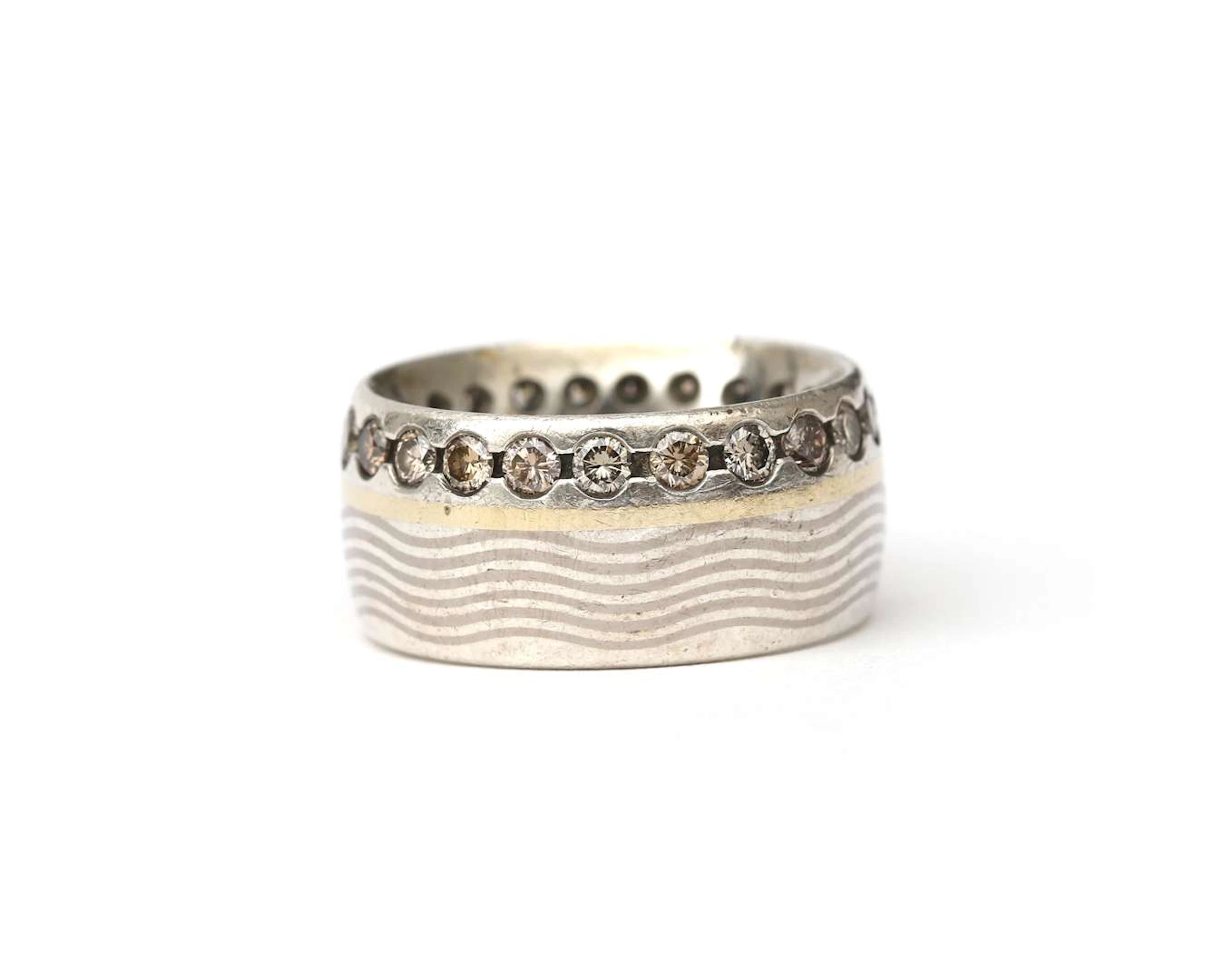 A 'mixed metal' ring in sterling silver and 18-carat yellow gold