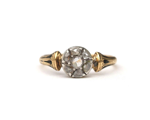 An 18k yellow gold ring set with rose-cut diamonds