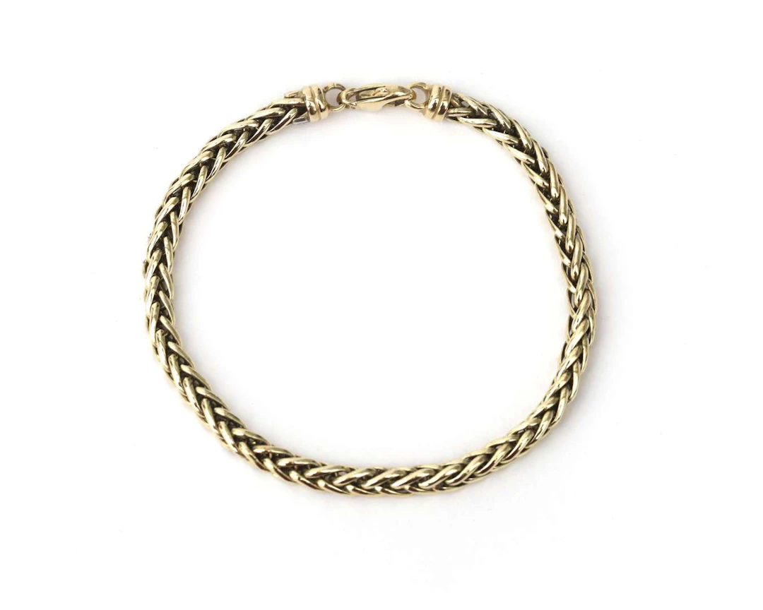 A 14k yellow gold foxtail link bracelet