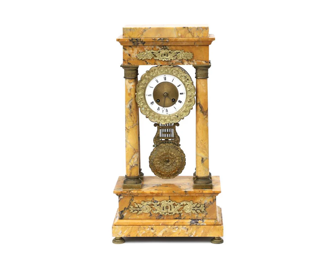 A yellow marble column clock, France, 19th century
