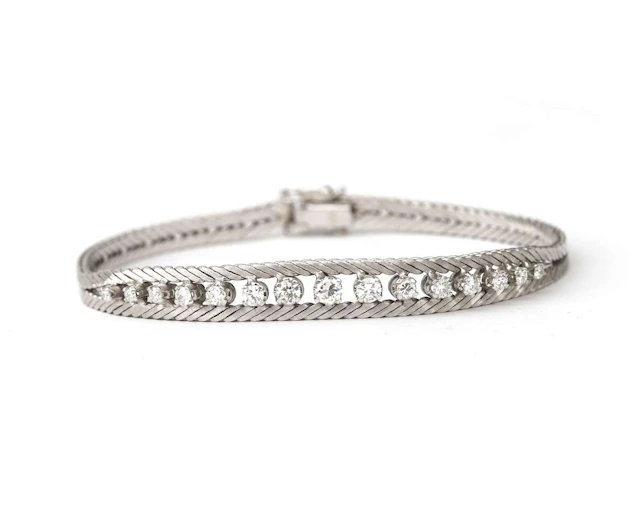 A 14k white gold bracelet with a diamond, from the 1970s