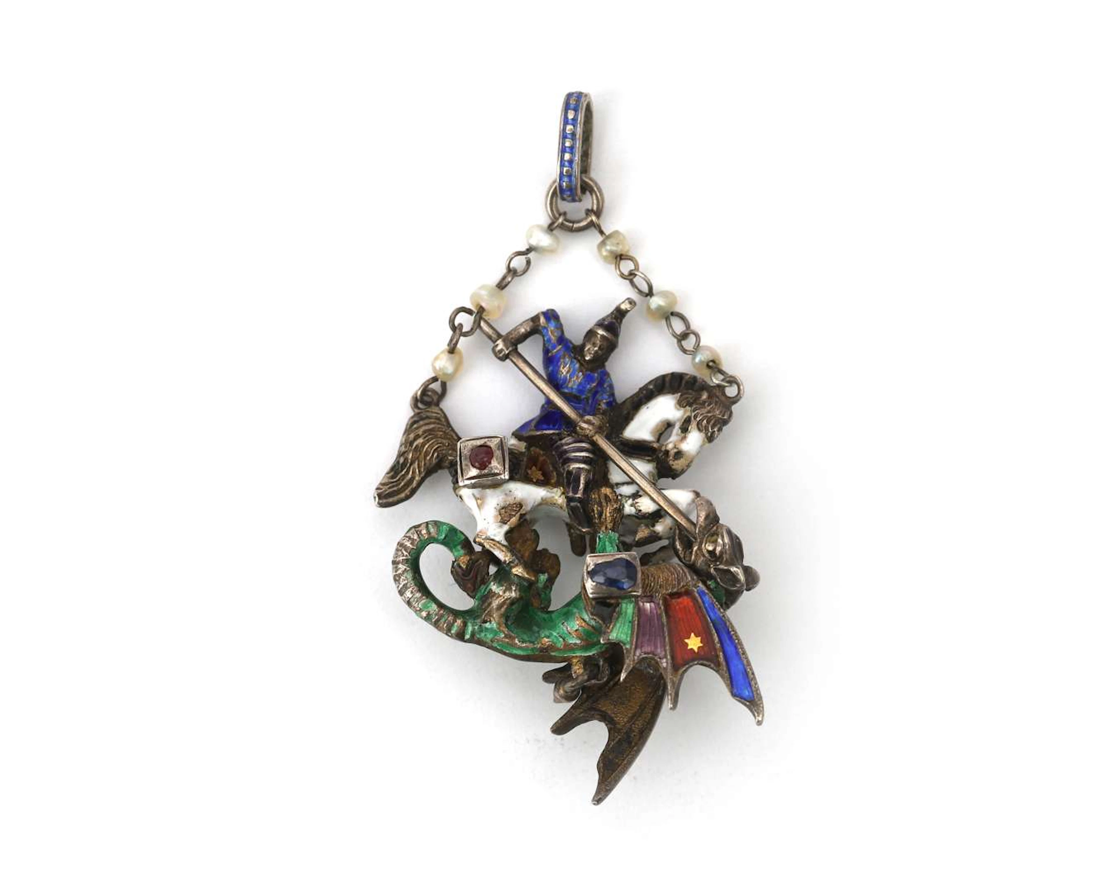 An enamelled silver pendant depicting St George and the dragon, late