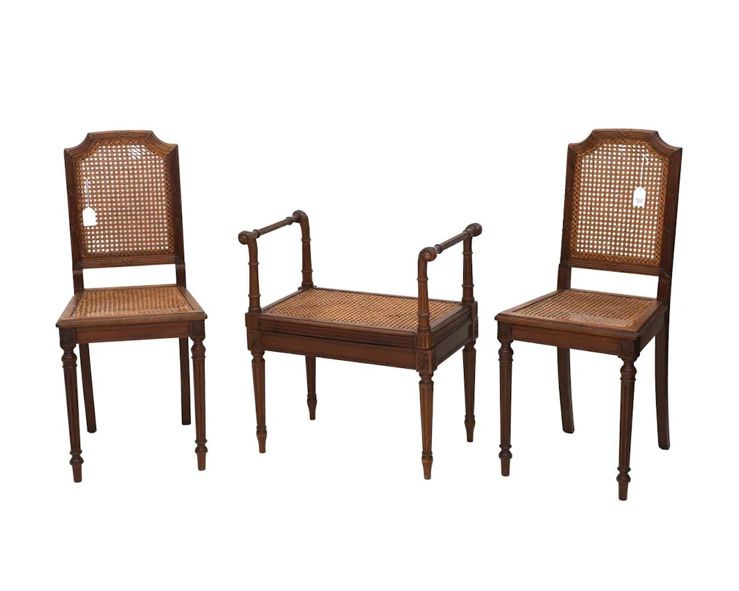 A pair of Louis XVI-style chairs and a footstool, 20th century