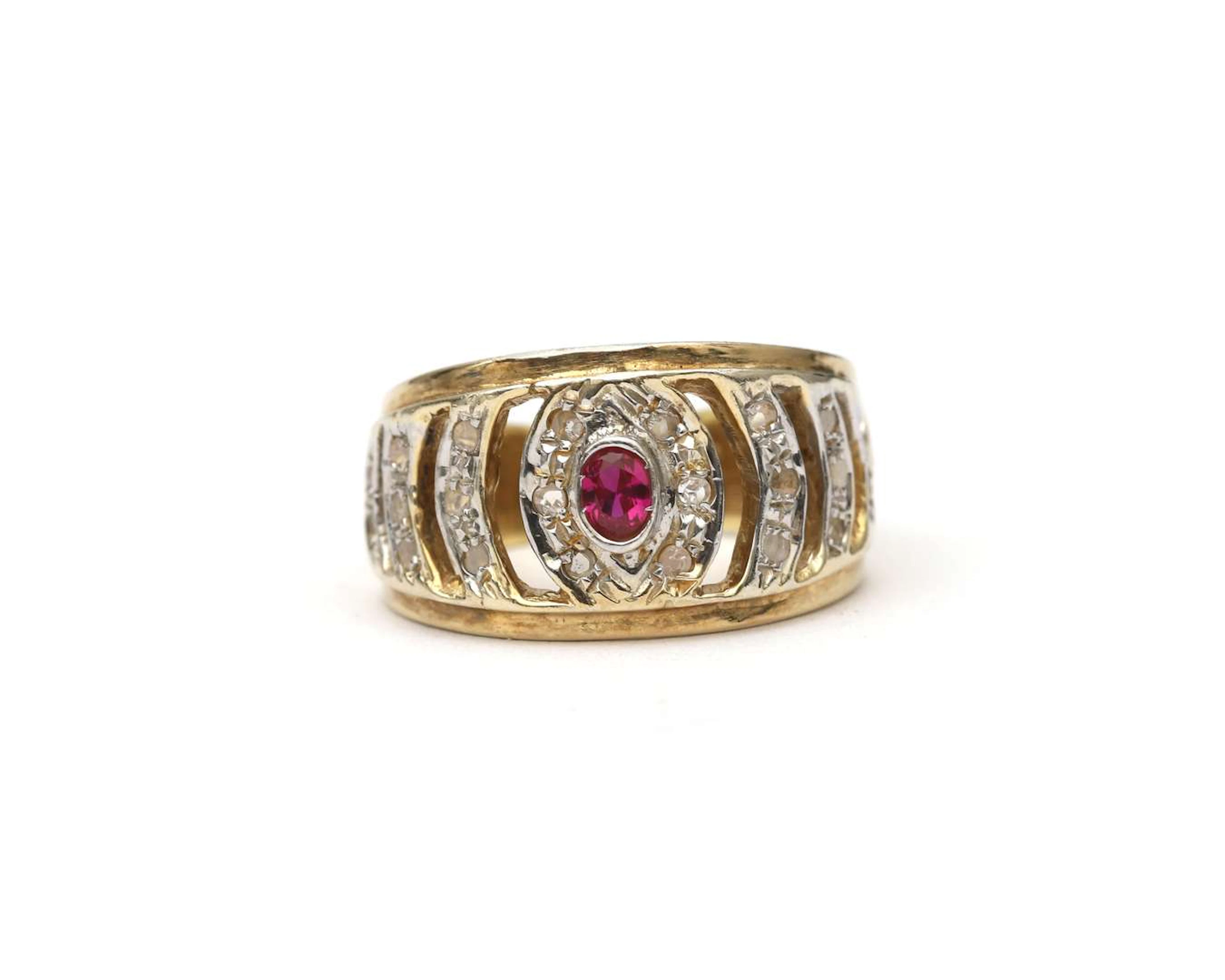 A BWG yellow gold band ring with a synthetic ruby and diamond