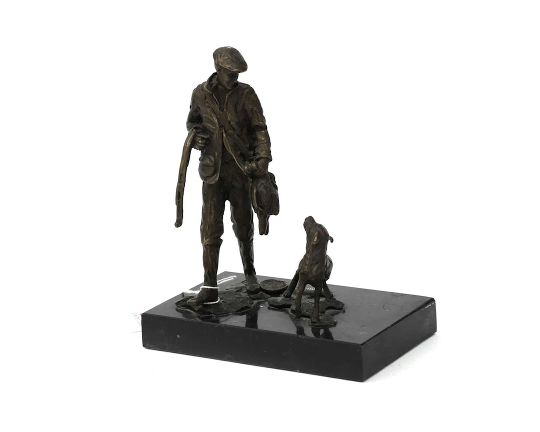 A small bronze group on a marble plinth. ‘The Successful Hunt’.