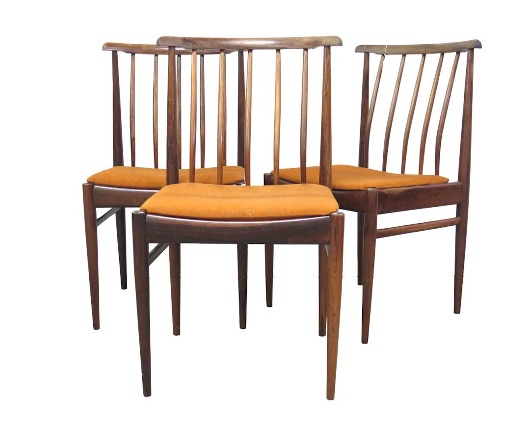 Three rosewood dining chairs with slatted backs. Alink & Wilhelm Almelo