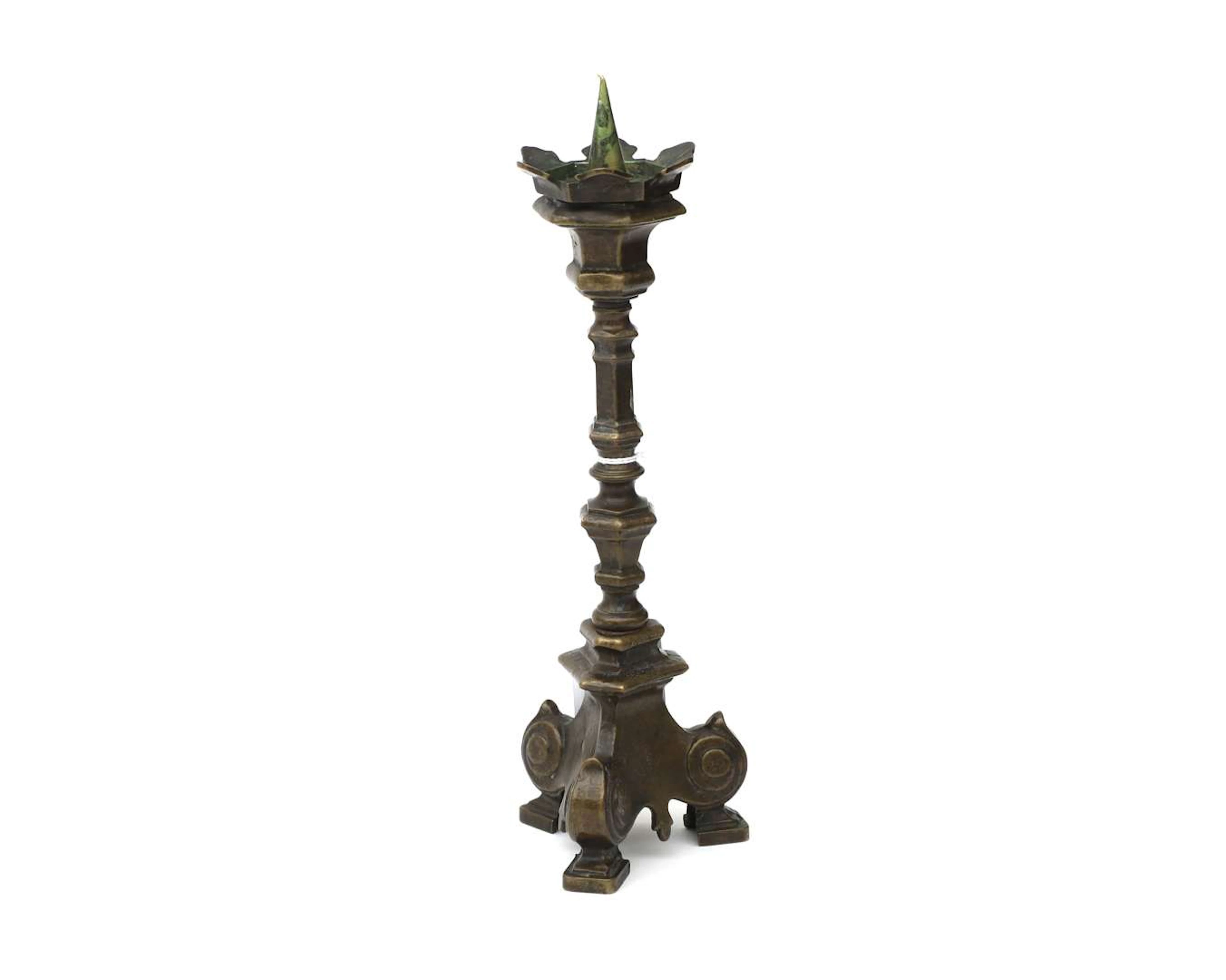 A bronze candlestick with three legs