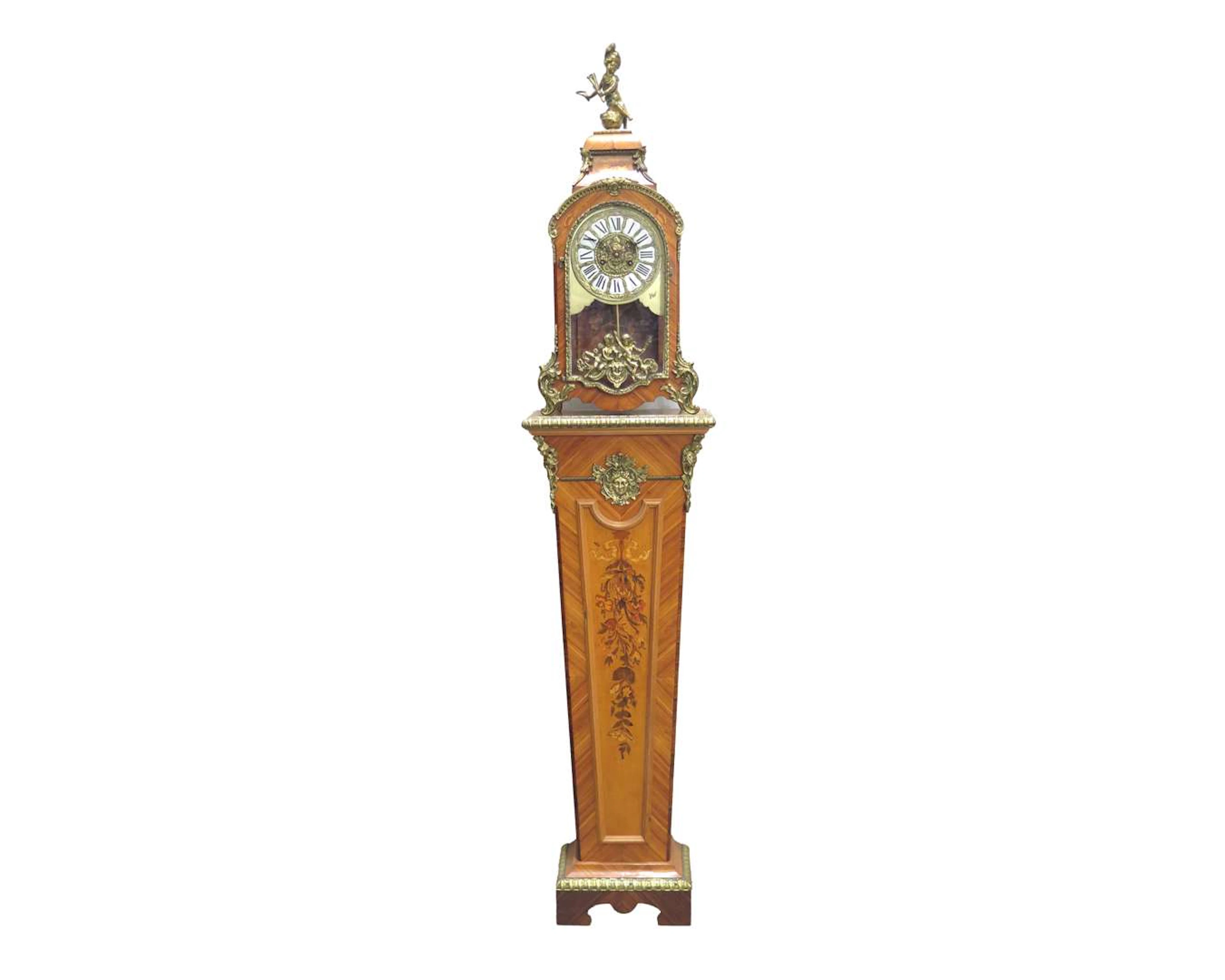 A rosewood and brass console clock on a matching pedestal. Louis XV