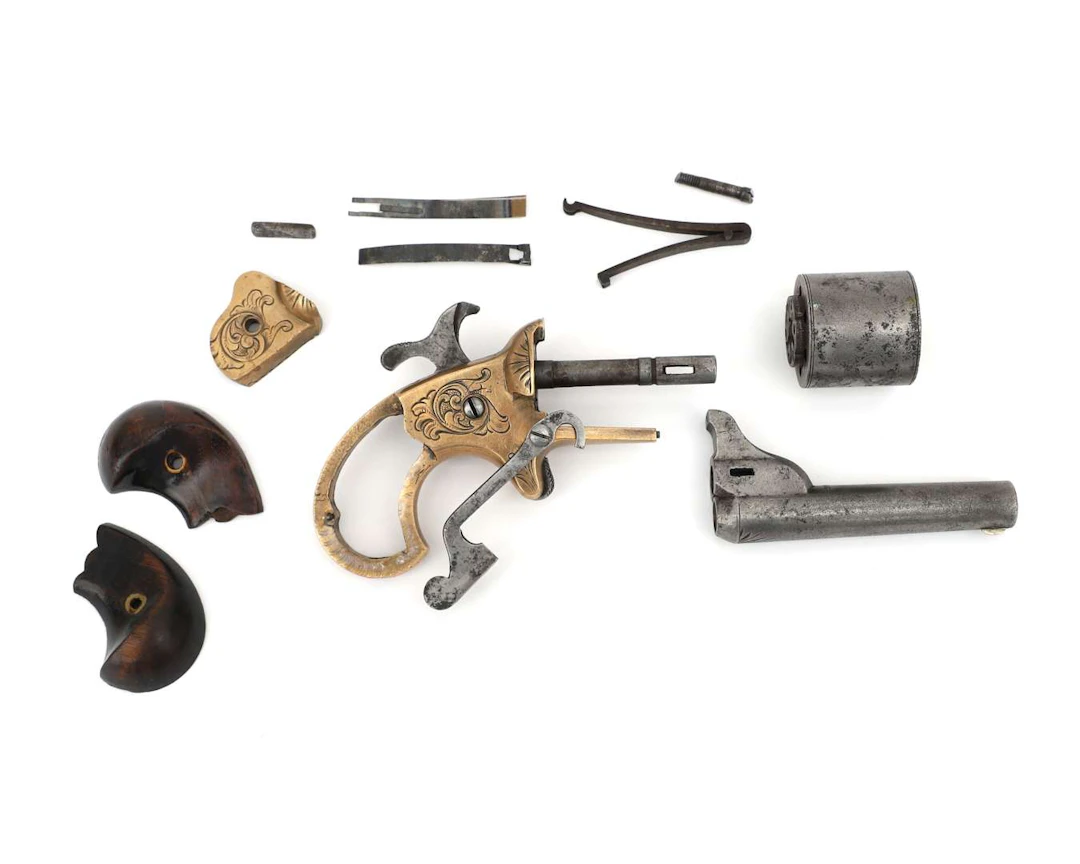 A set of parts for a rimfire derringer pistol, manufactured by: National