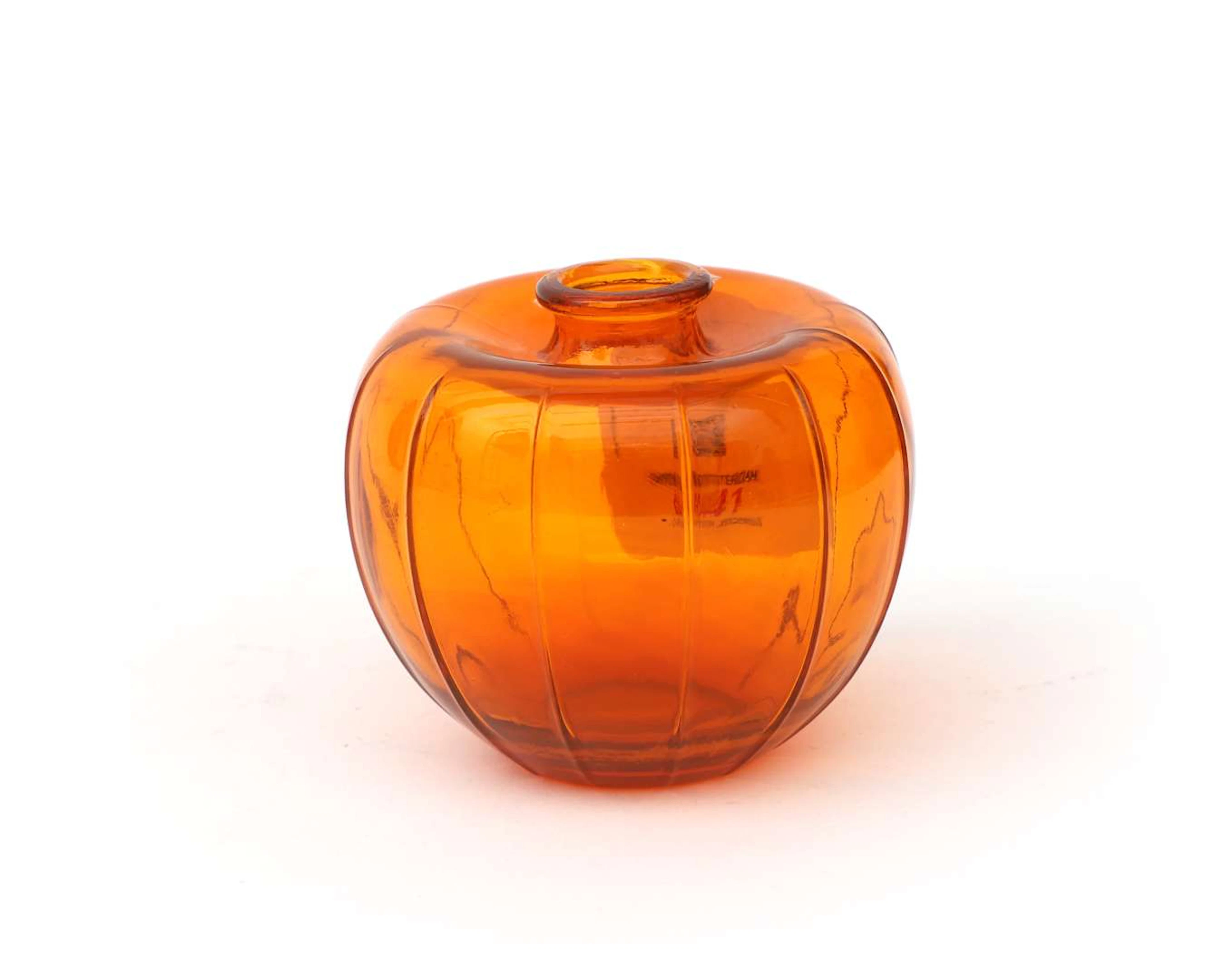 An orange pressed-glass ‘liberation vase’. Designed by A.D. Copier