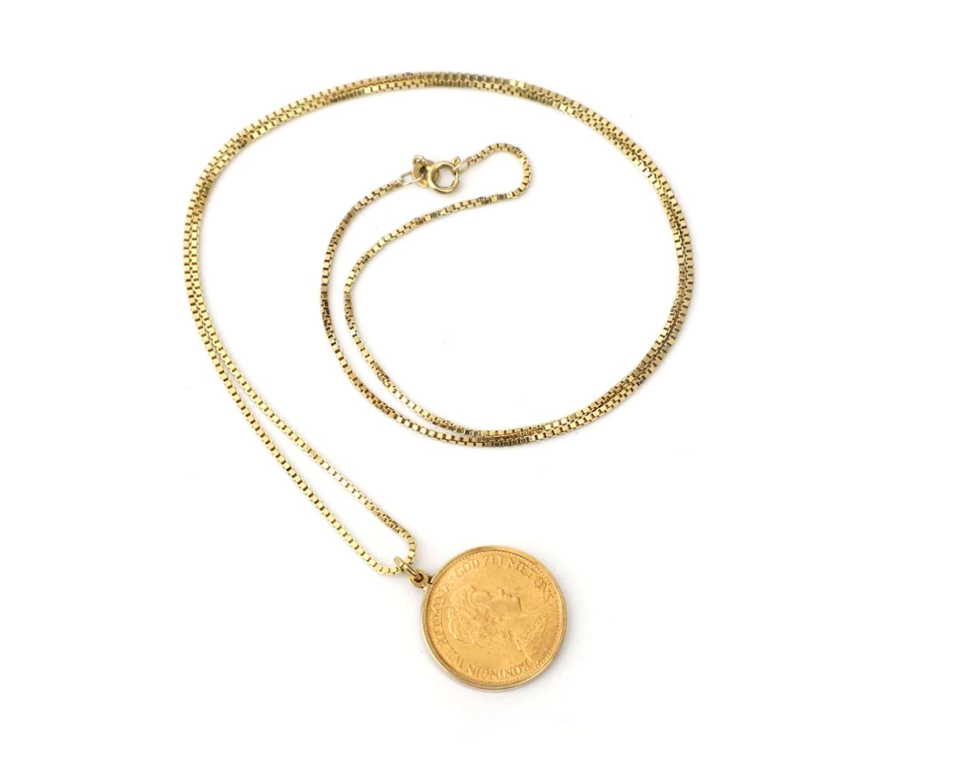 A 10-guilder Wilhelmina 1913 coin pendant on a 14k yellow gold necklace
