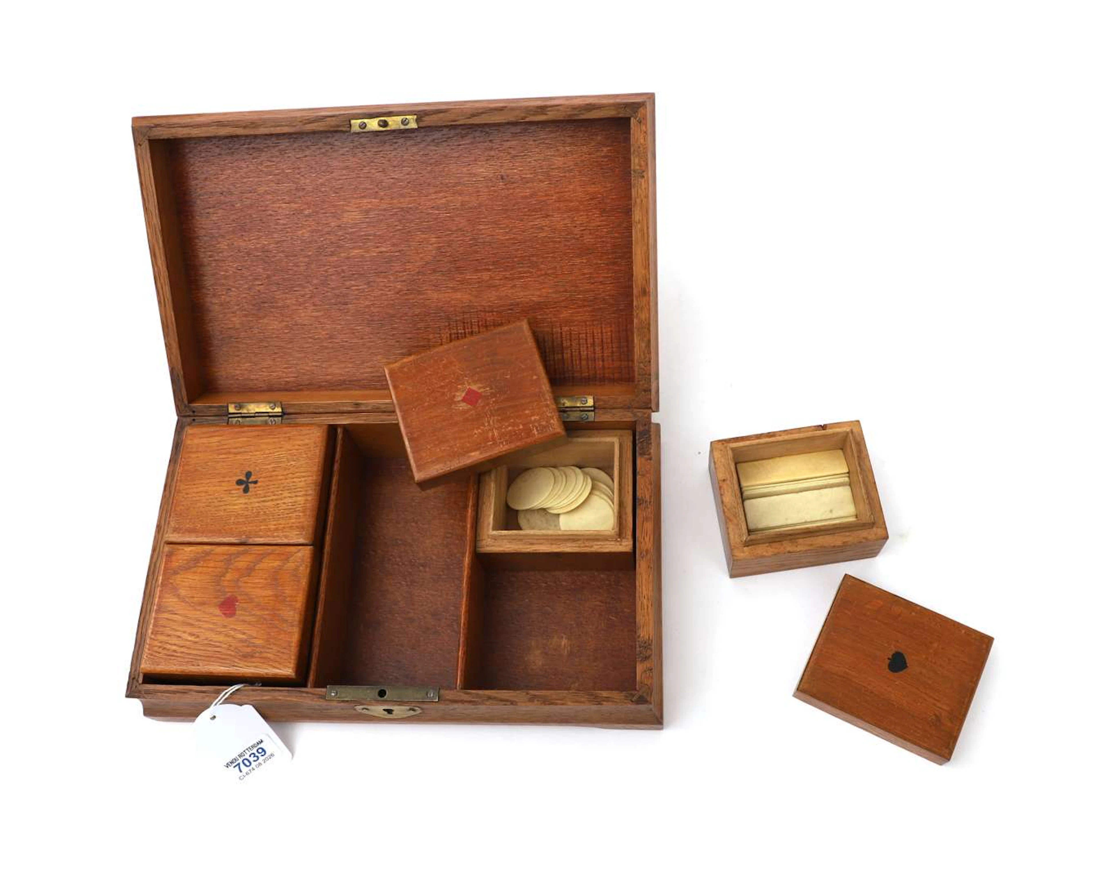A games box containing bone tokens, 20th century