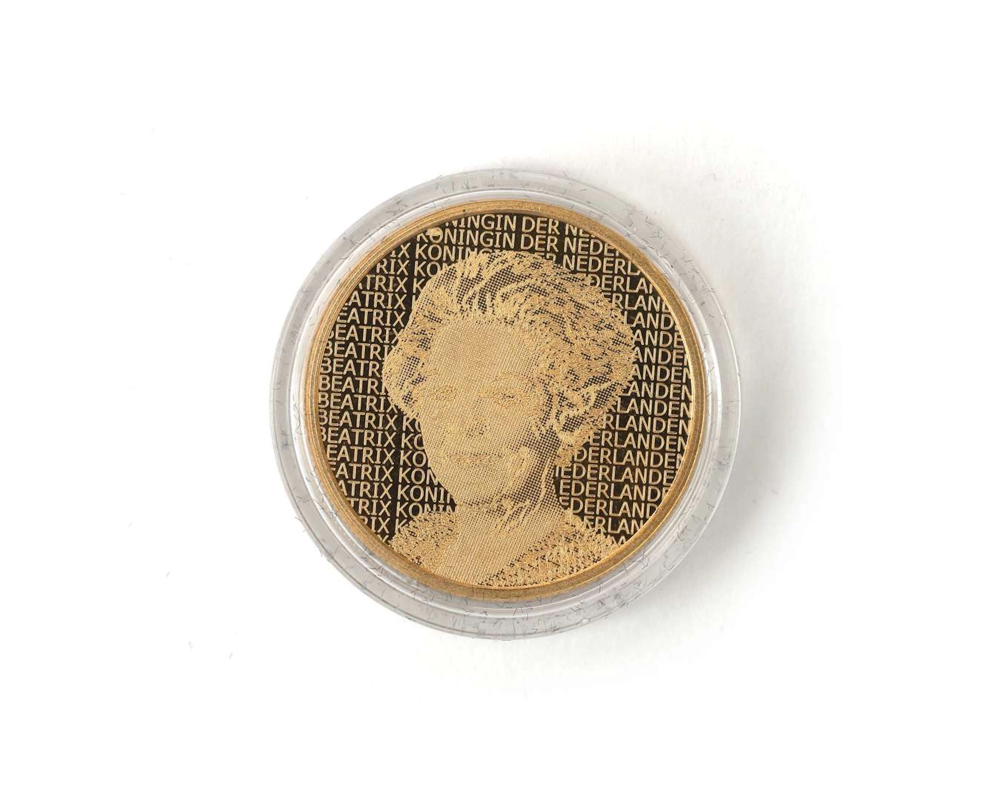 A gold coin, ten guilders, Rembrandt van Rijn, accompanying a gold
