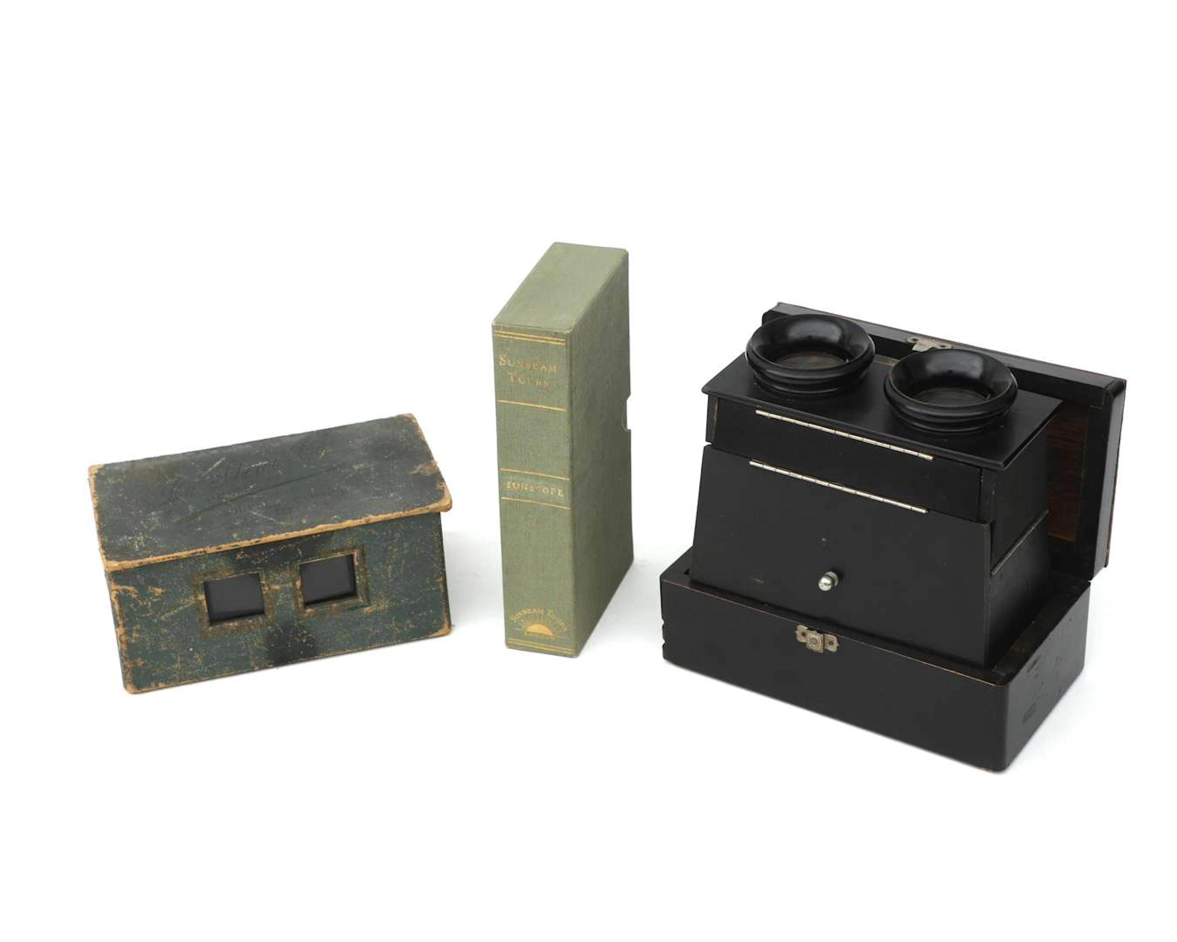 Two folding stereo viewers with stereo photographs, first quarter