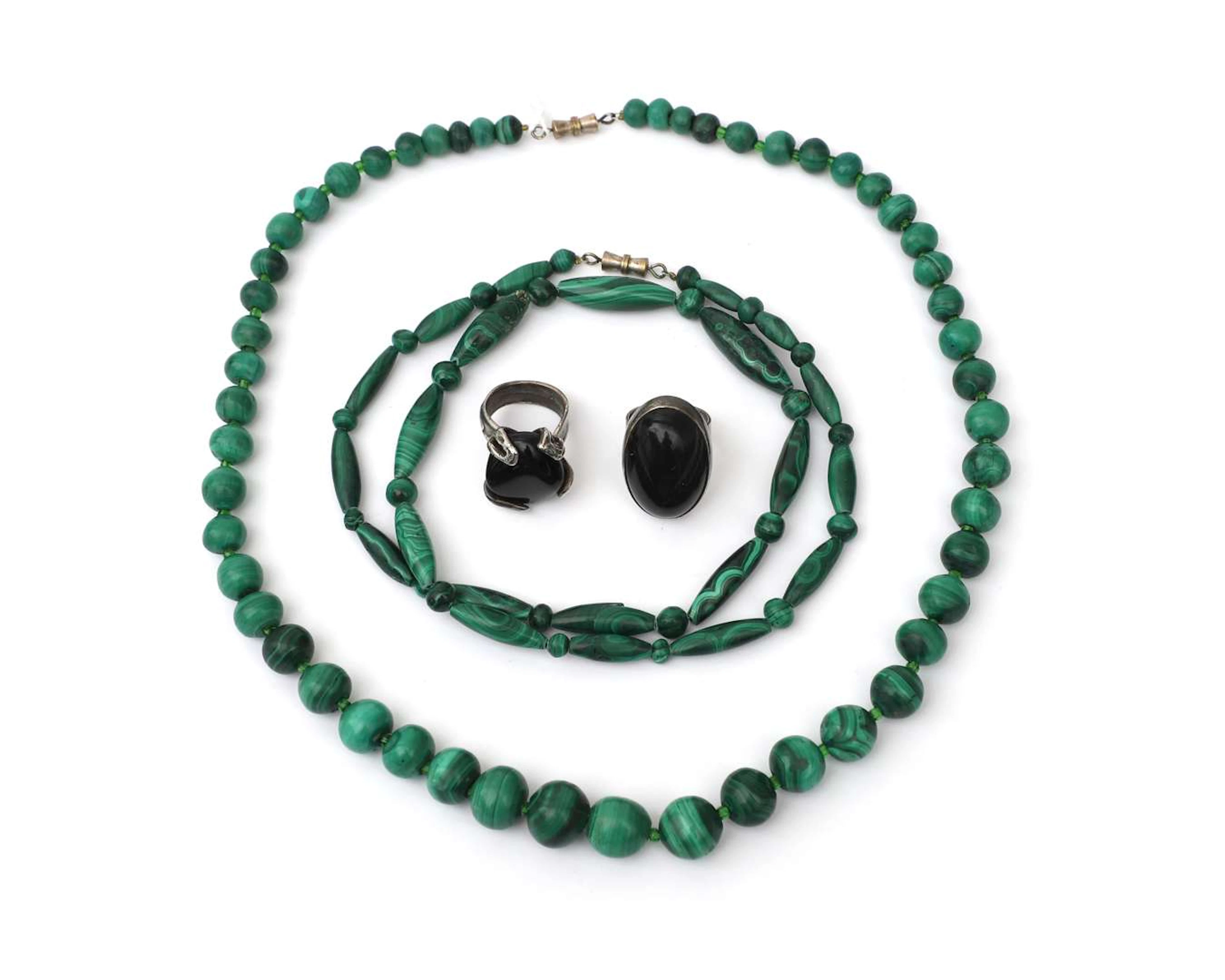 Two malachite necklaces and two sterling silver rings set with onyx