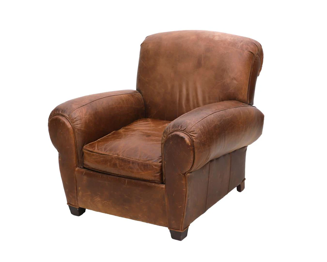 A brown leather club armchair, made by Arthur McMilan (private), 20th century