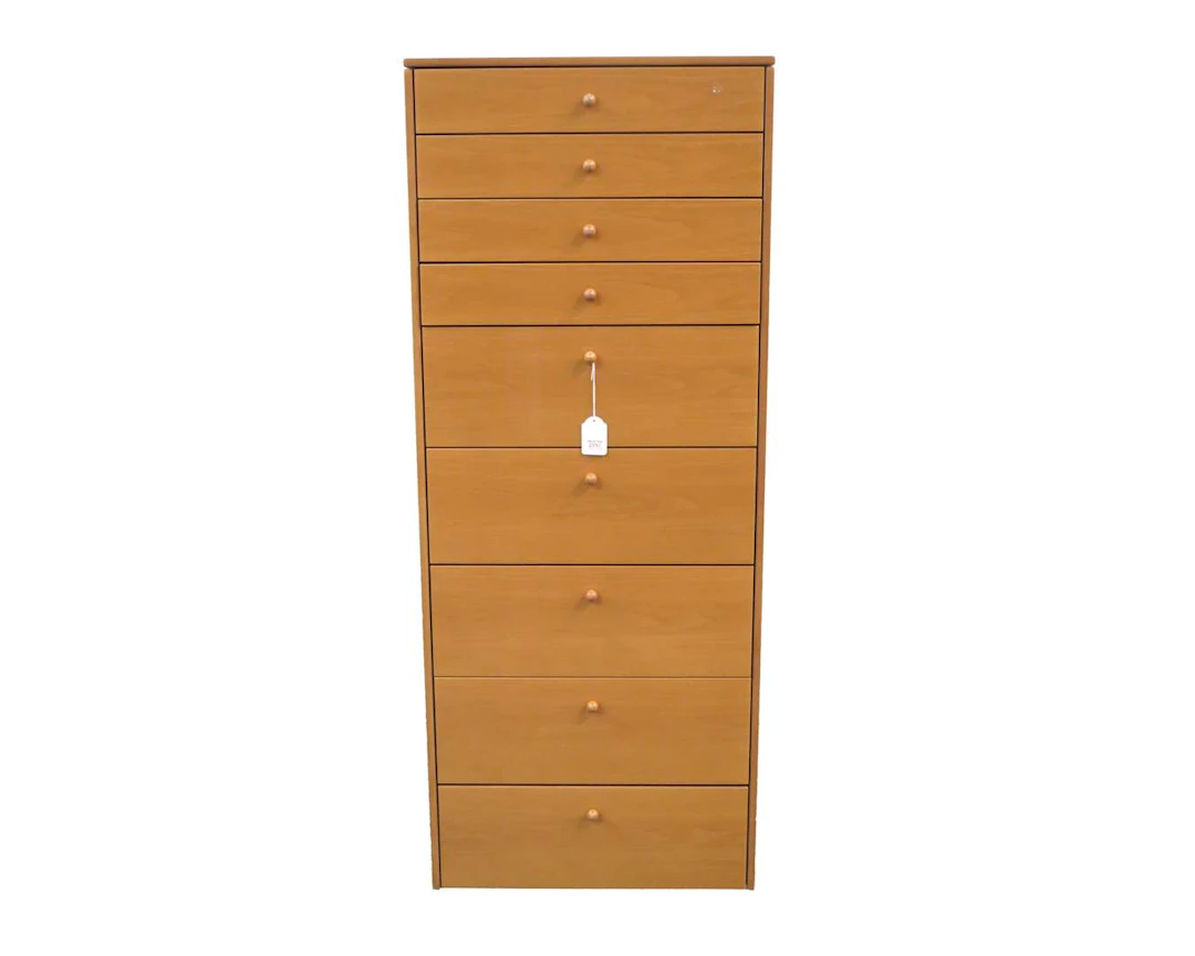 A veneered MDF wooden chest of drawers with nine drawers. Late 20th