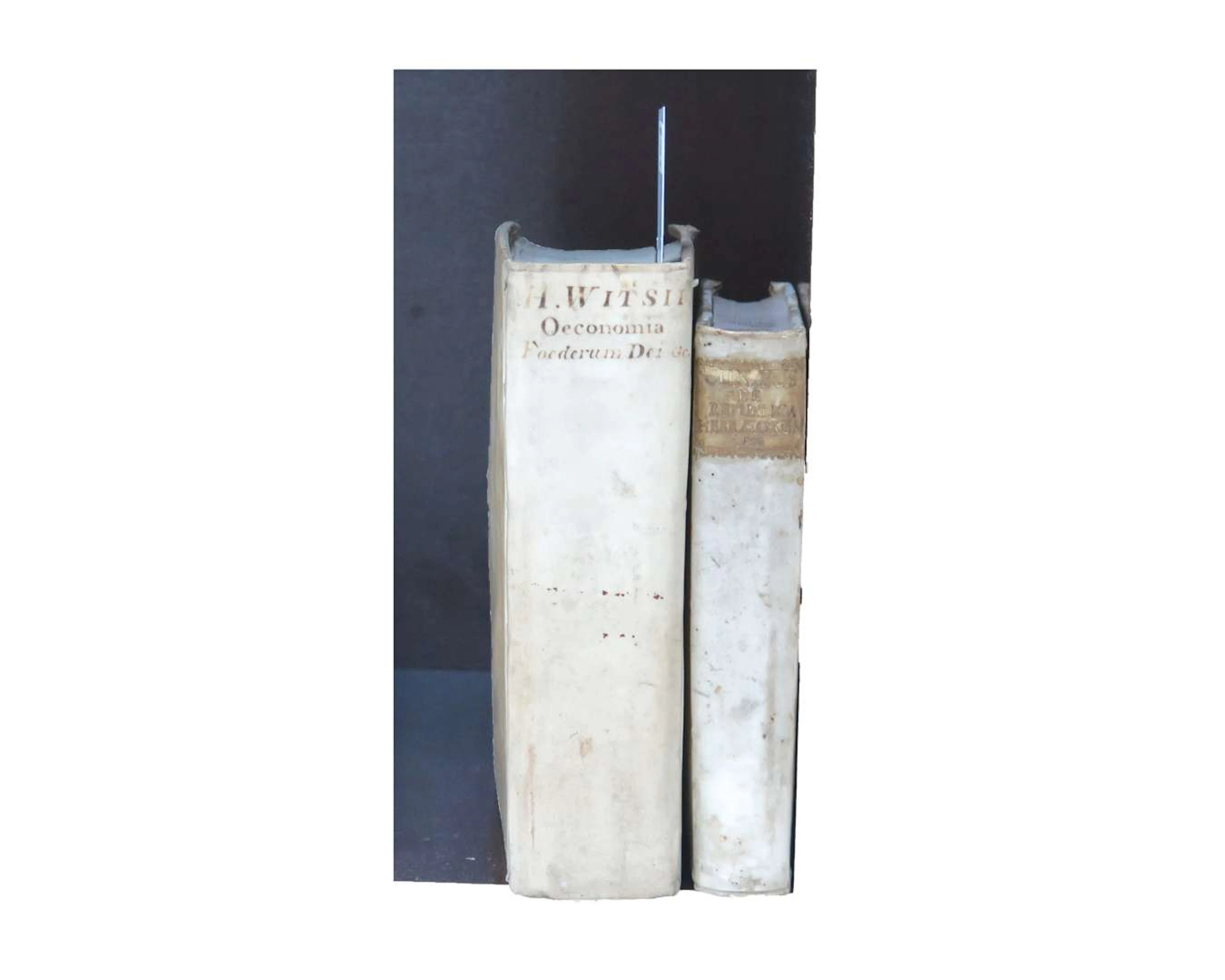 Two theological works in Latin, in parchment bindings, by H. Witsius