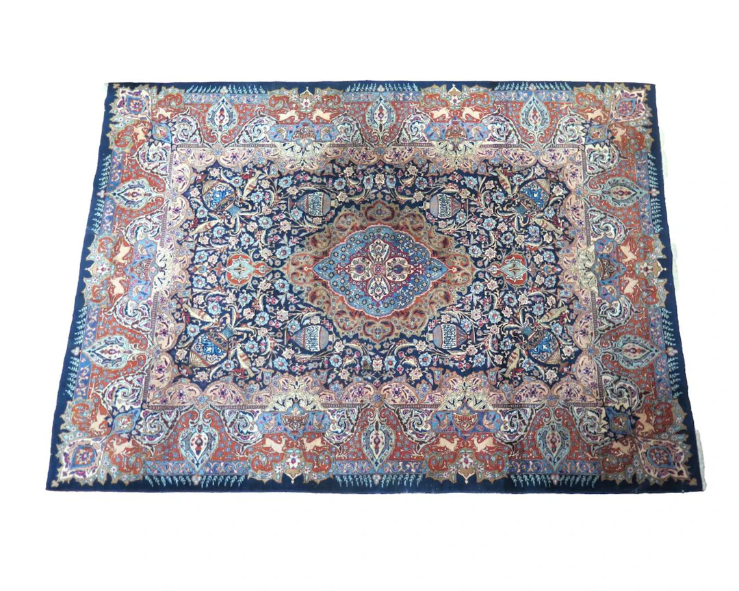 An oriental rug. Kashmar. Dimensions: approx. 338 x 242 cm.