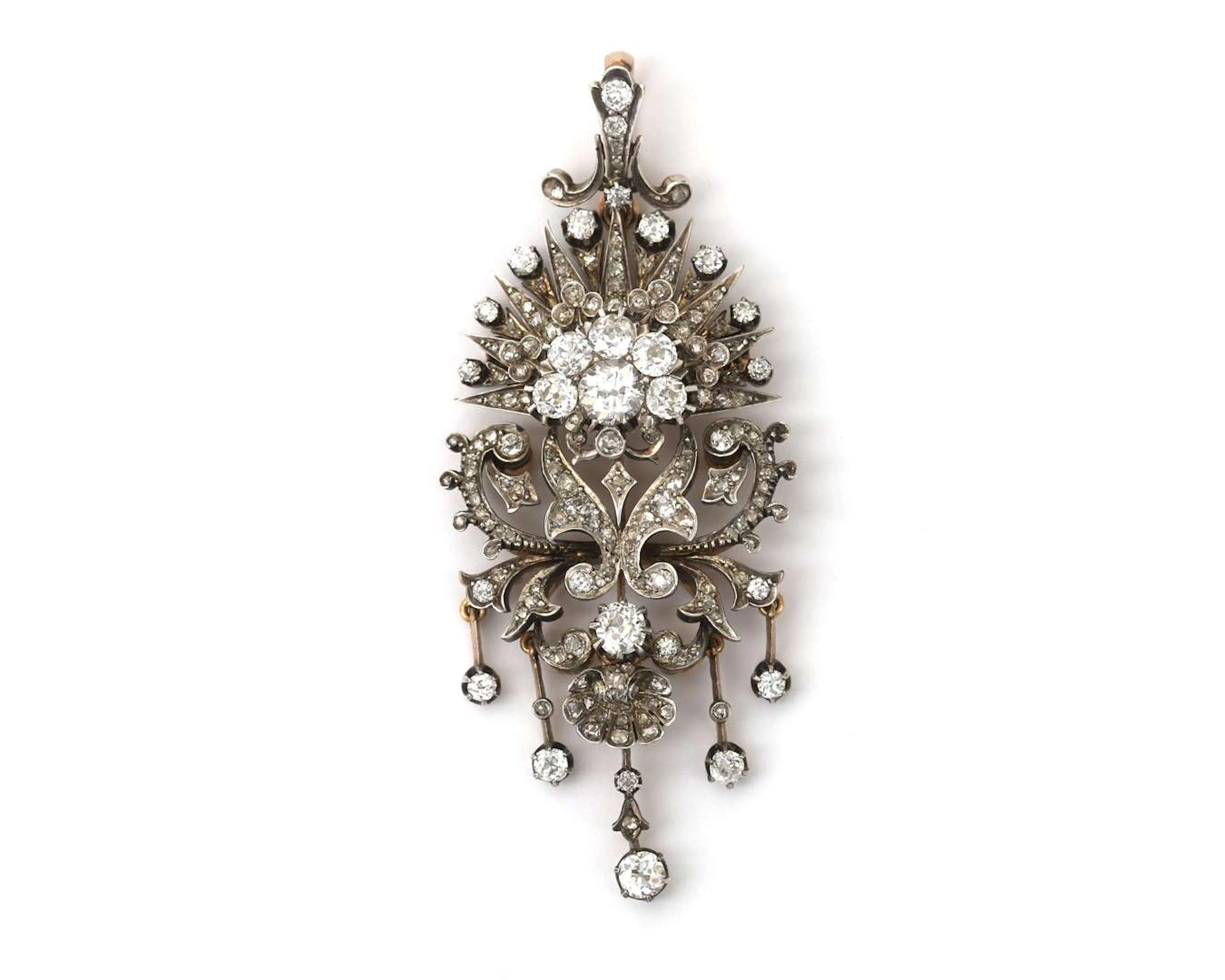 An 18-carat yellow gold devant-de-corsage with silver and diamonds