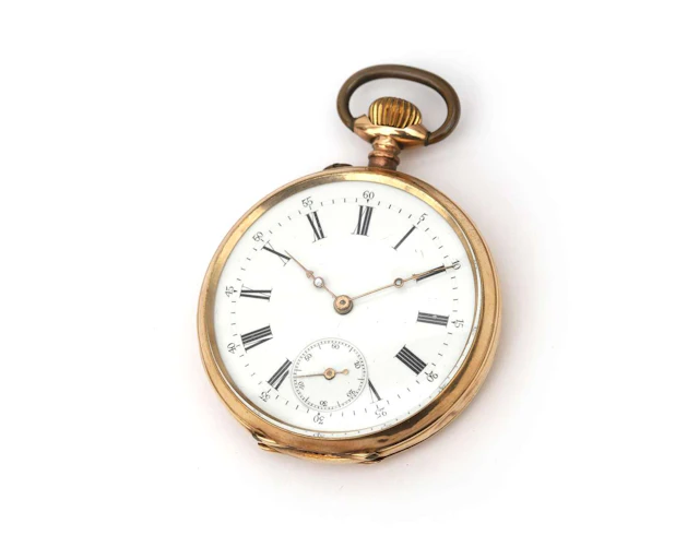 A 14k yellow gold pocket watch with an engraved herald