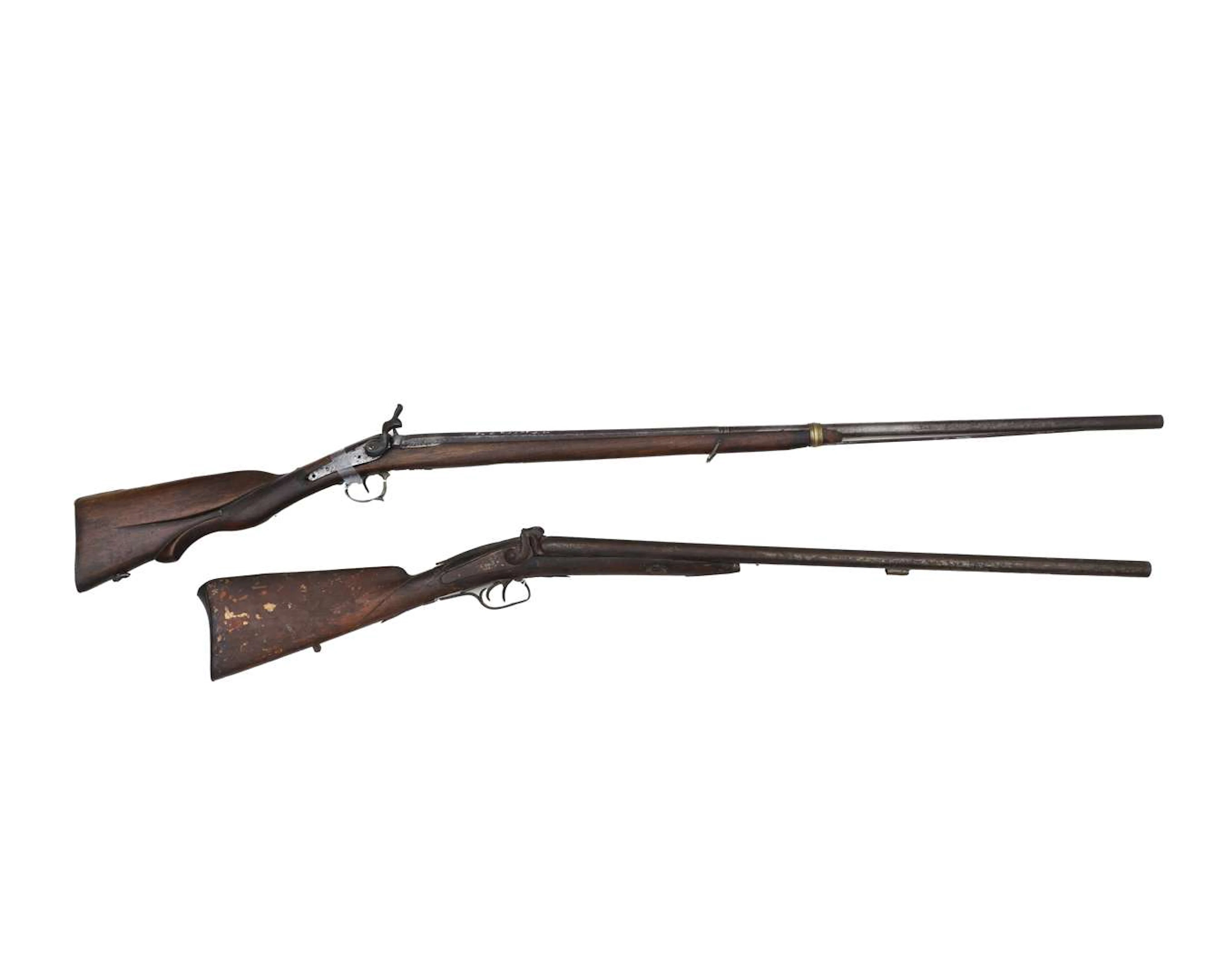A single-barrelled and a double-barrelled percussion rifle, c. 1900