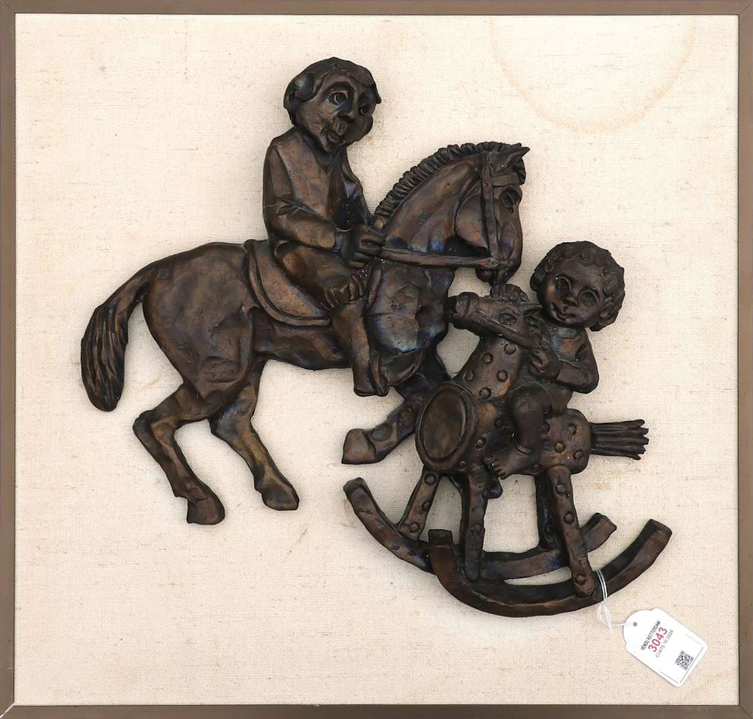 A bronze wall relief, possibly by Harry Storms (1945)