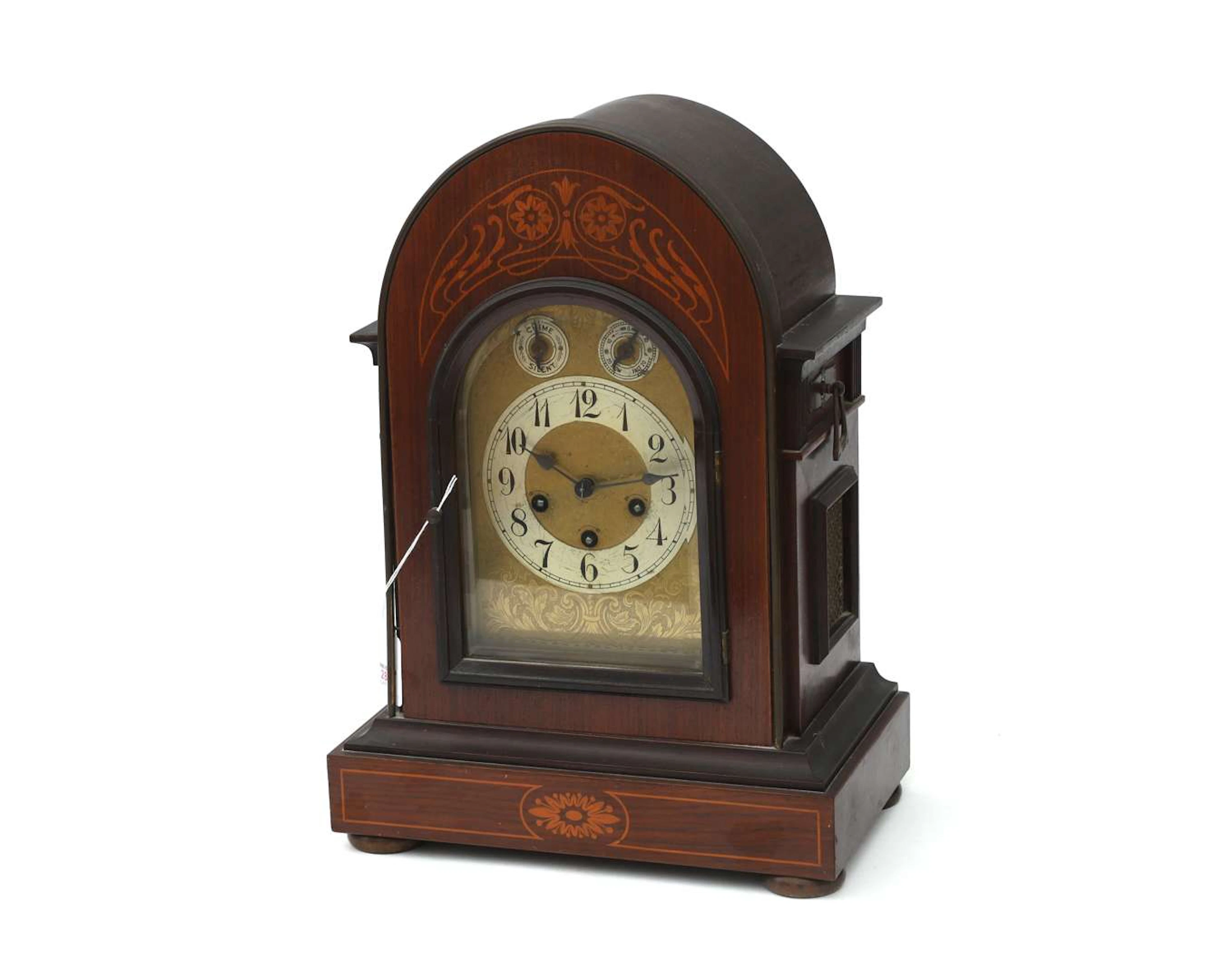 A walnut table clock with a striking mechanism. Junghans. Germany