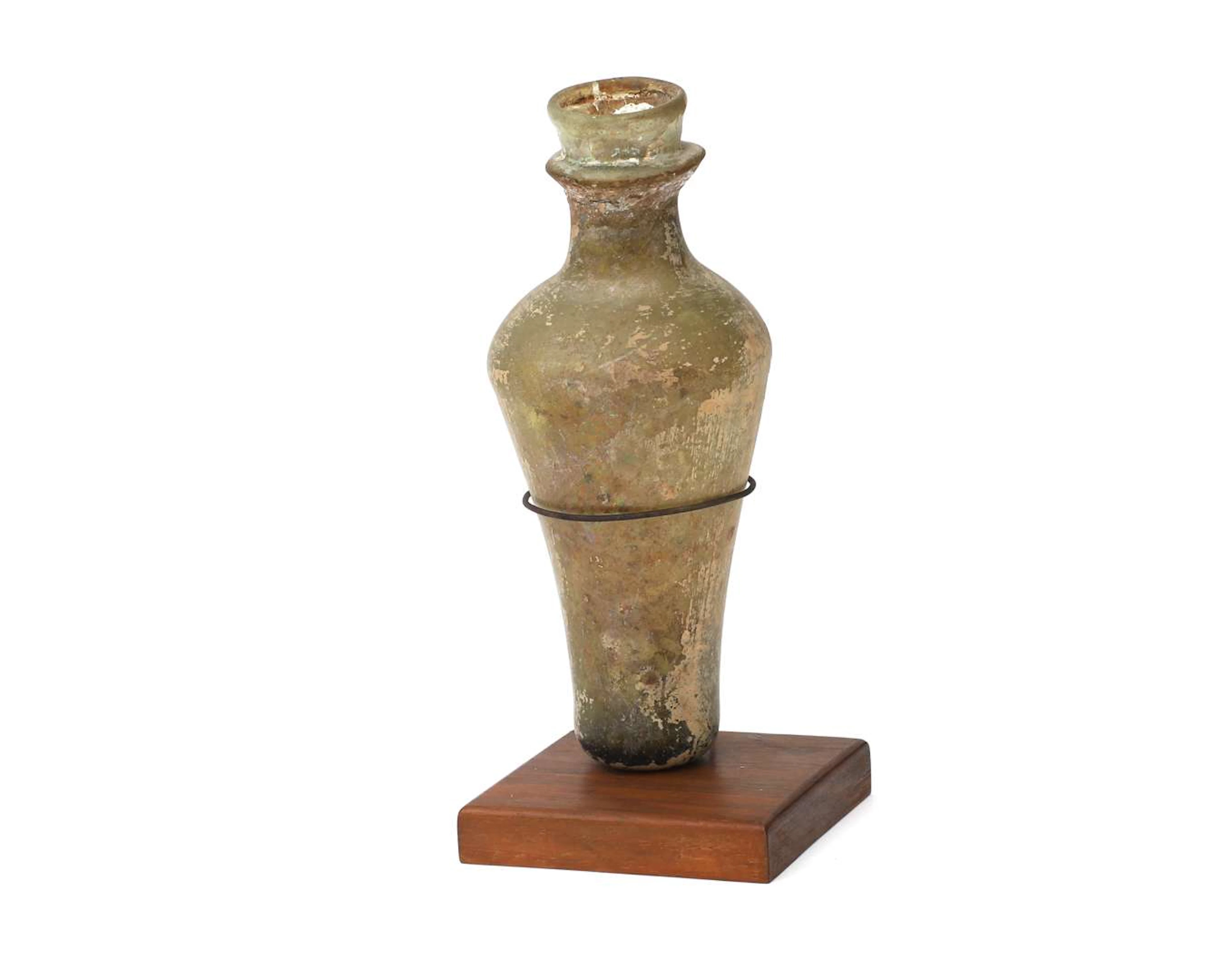 A glass bottle, probably Roman Empire, 3rd-4th century AD